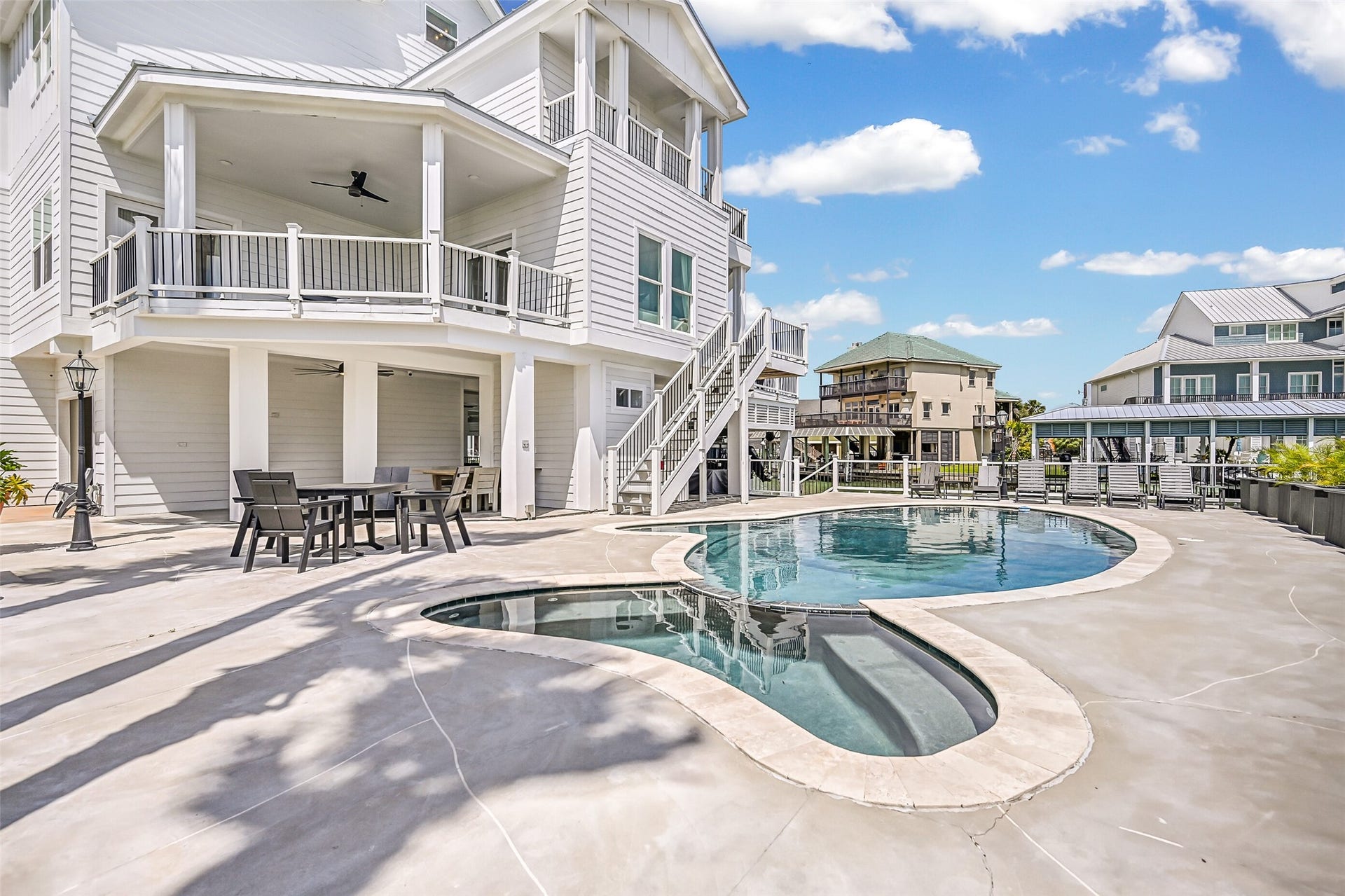 1614 Castaway Street, Tiki Island, TX 77554 Why leave home when the backyard feels like a getaway? A heated pool and spa pair beautifully with the waterfront setting for sun-filled afternoons and relaxing evenings outside.