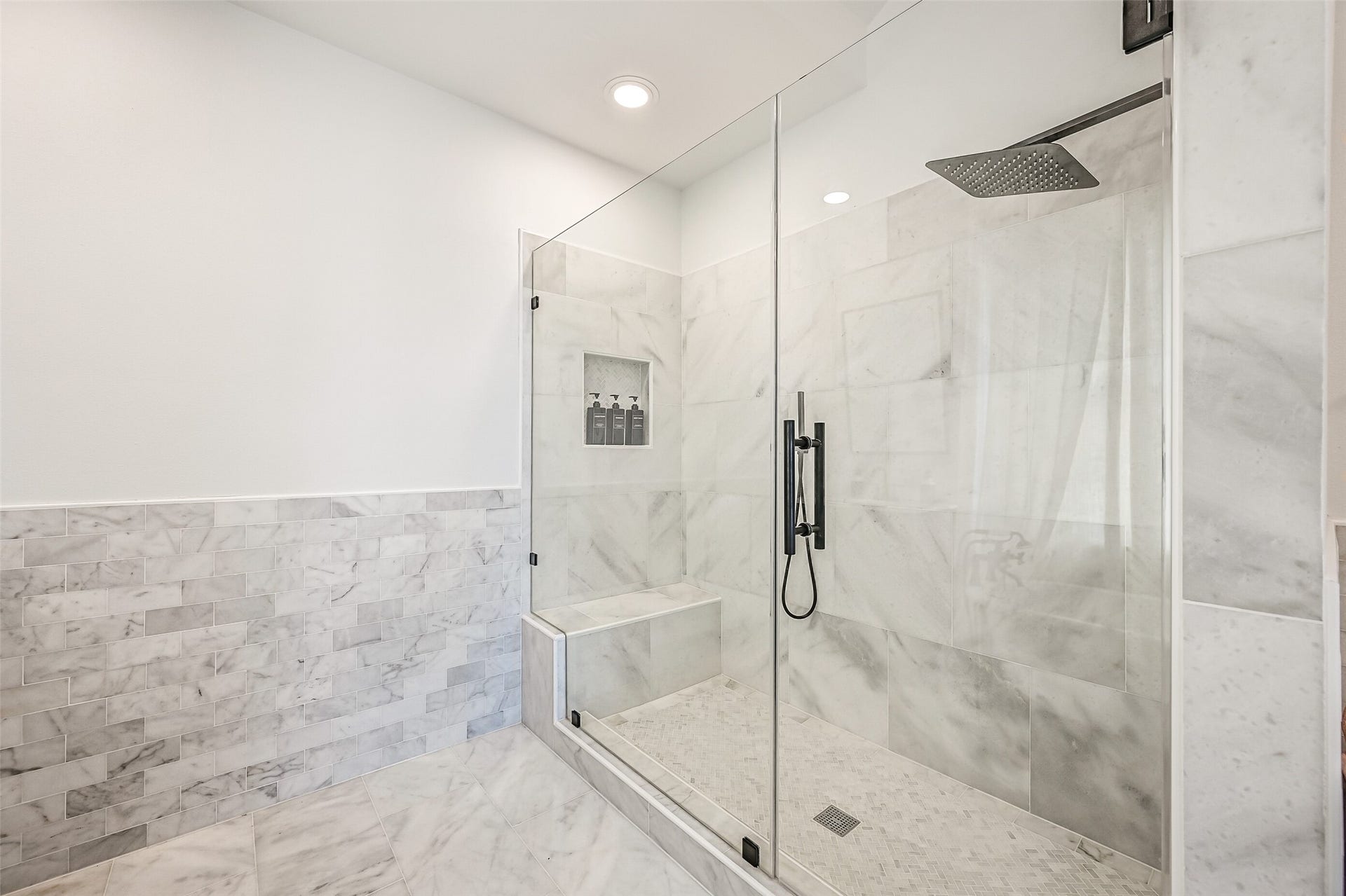 1614 Castaway Street, Tiki Island, TX 77554 The spacious walk-in shower brings everyday comfort to the main-level accommodations. Guests can settle in without feeling like they are simply borrowing space.