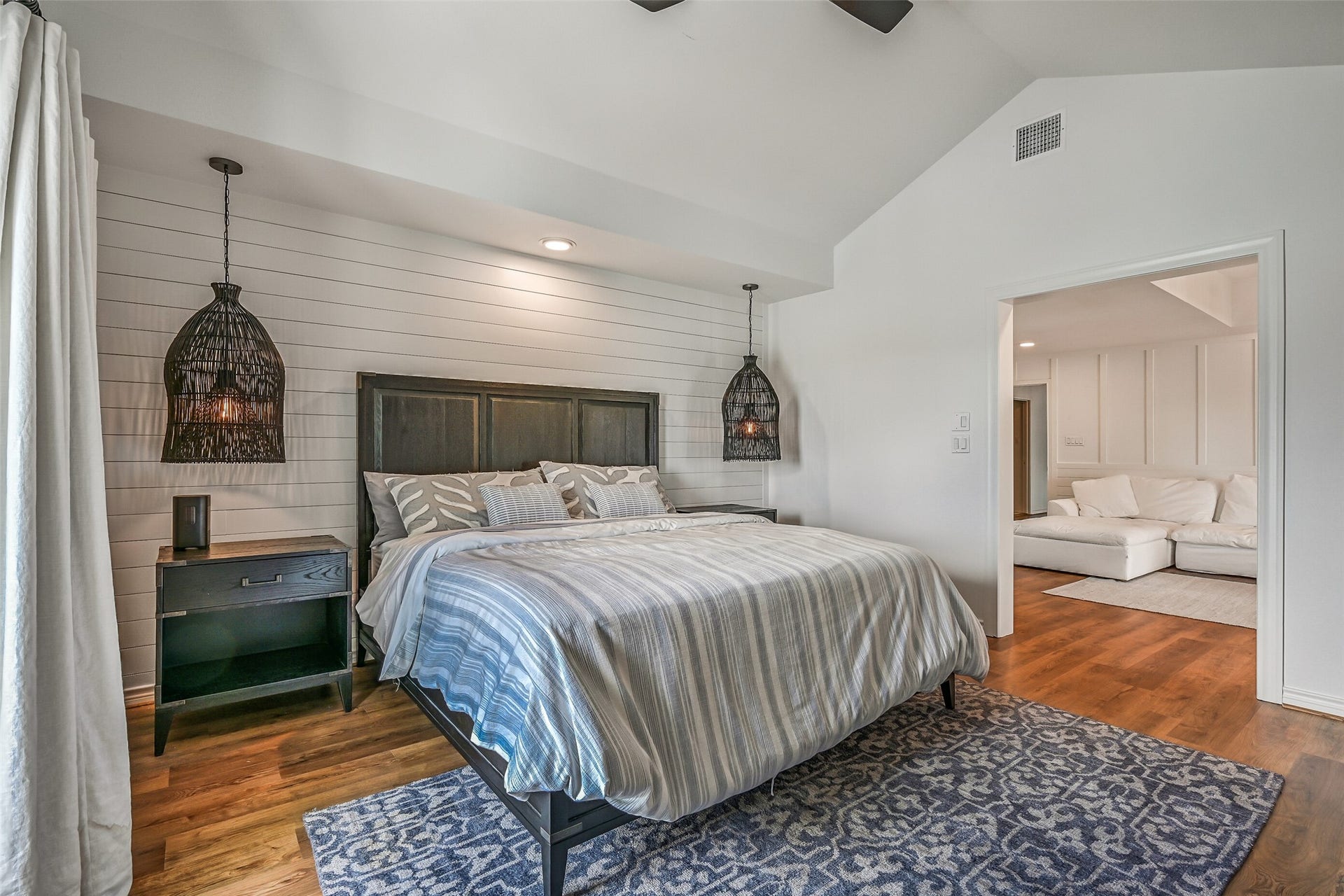 1614 Castaway Street, Tiki Island, TX 77554 A peaceful retreat after a full day on the water. Generous proportions and access to outdoor space give the primary bedroom a welcome sense of privacy.