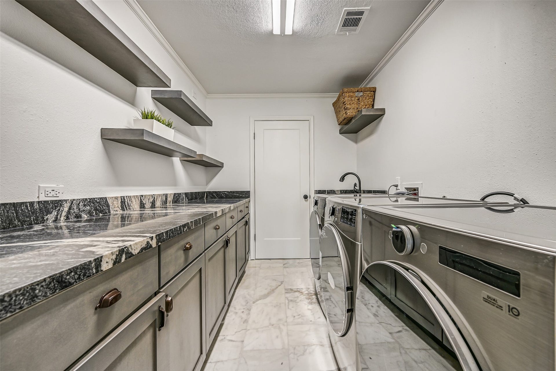 1614 Castaway Street, Tiki Island, TX 77554 A home that welcomes a crowd needs practical spaces that can keep up. Extensive cabinetry and generous work surfaces help make busy weekends easier to manage.