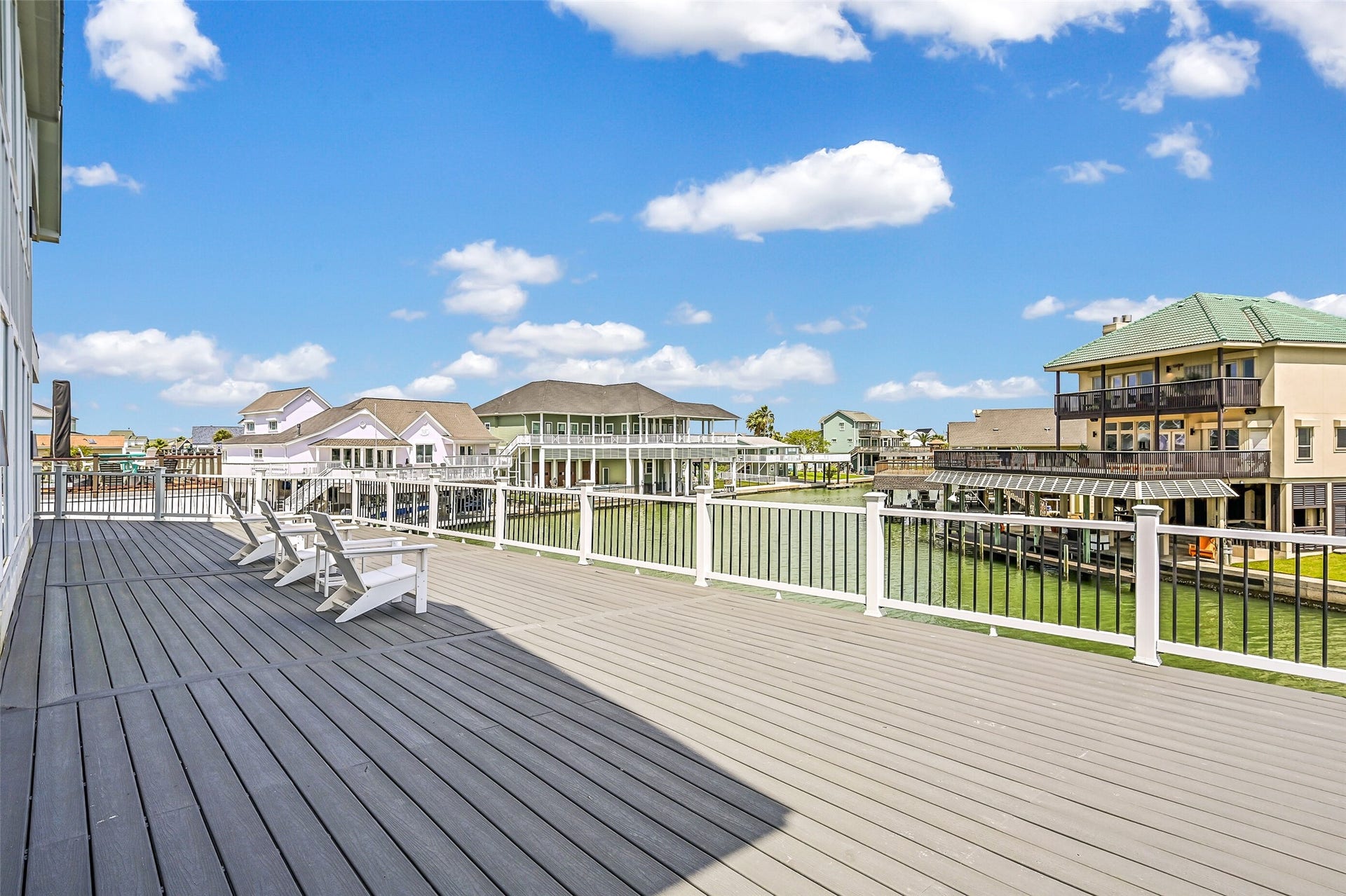 1614 Castaway Street, Tiki Island, TX 77554 Morning coffee may become your favorite part of the day here. The private deck overlooks the canal and creates a peaceful outdoor extension of the primary suite.