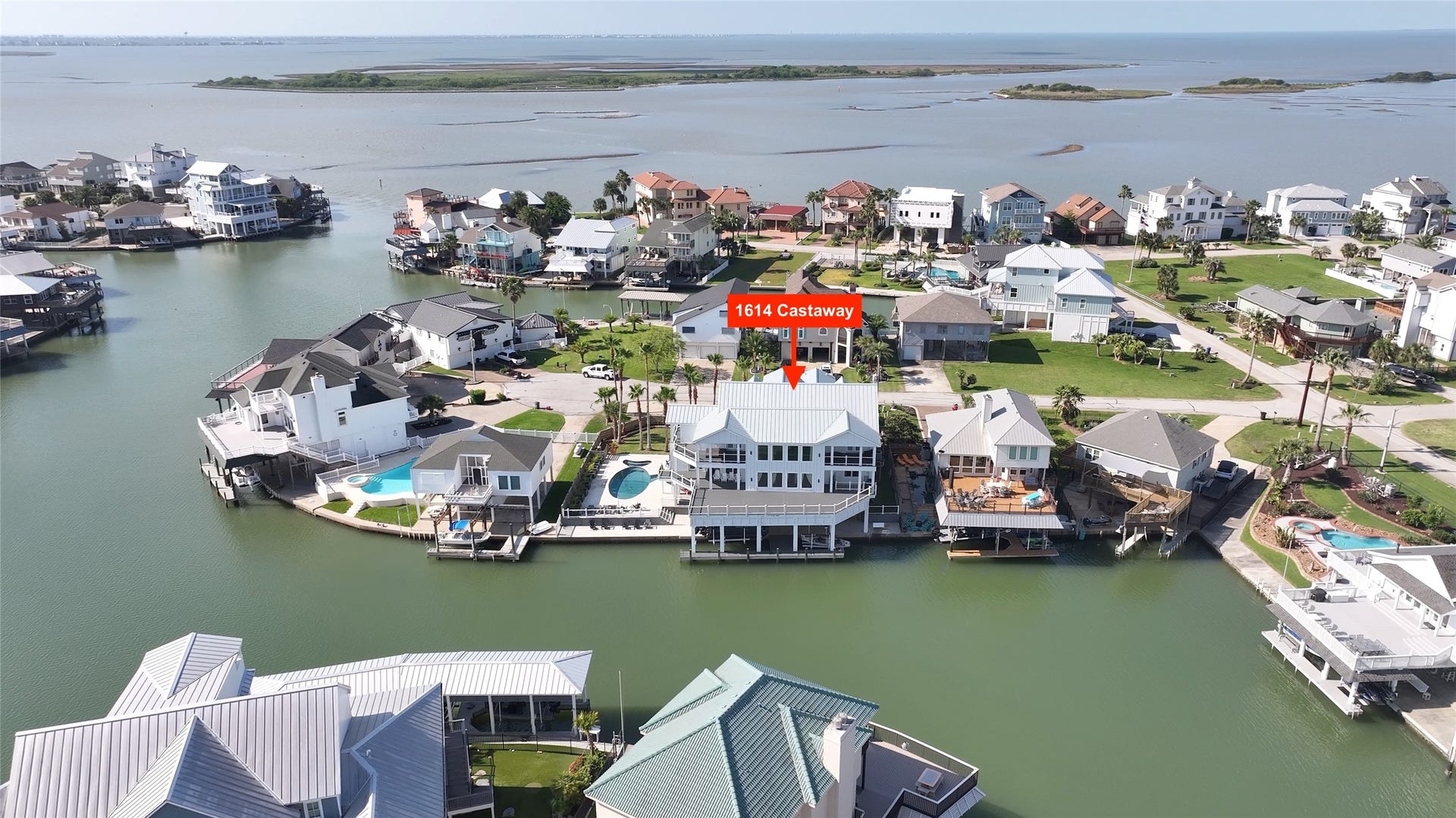 1614 Castaway Street, Tiki Island, TX 77554 This aerial puts the Tiki lifestyle into perspective. The surrounding waterways connect home with the boating experience that makes this island community so special.