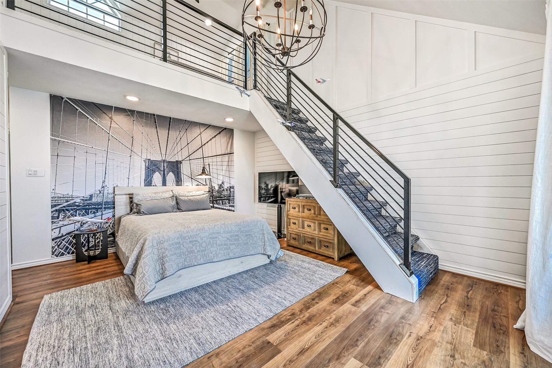 1614 Castaway Street, Tiki Island, TX 77554 Every guest can find a space that feels like their own. Distinctive details give this bedroom personality while adding another comfortable retreat within the home.