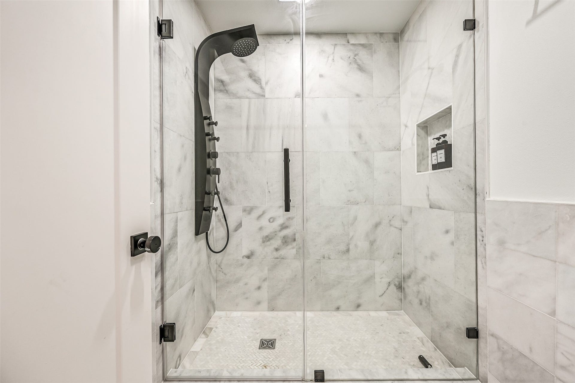 1614 Castaway Street, Tiki Island, TX 77554 A spacious walk-in shower and private bath make extended visits feel effortless. It is another thoughtful feature for a home built to welcome a crowd.