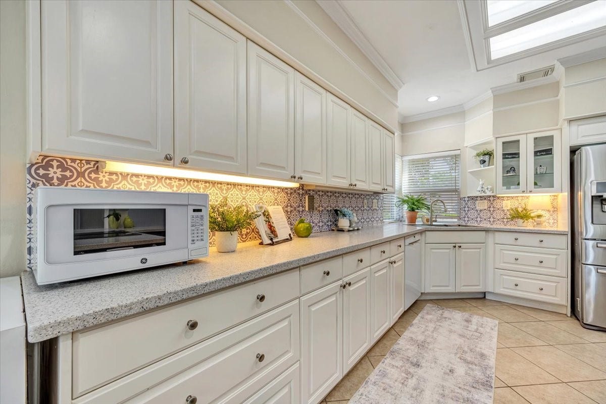 The backsplash is removable peel and stick.