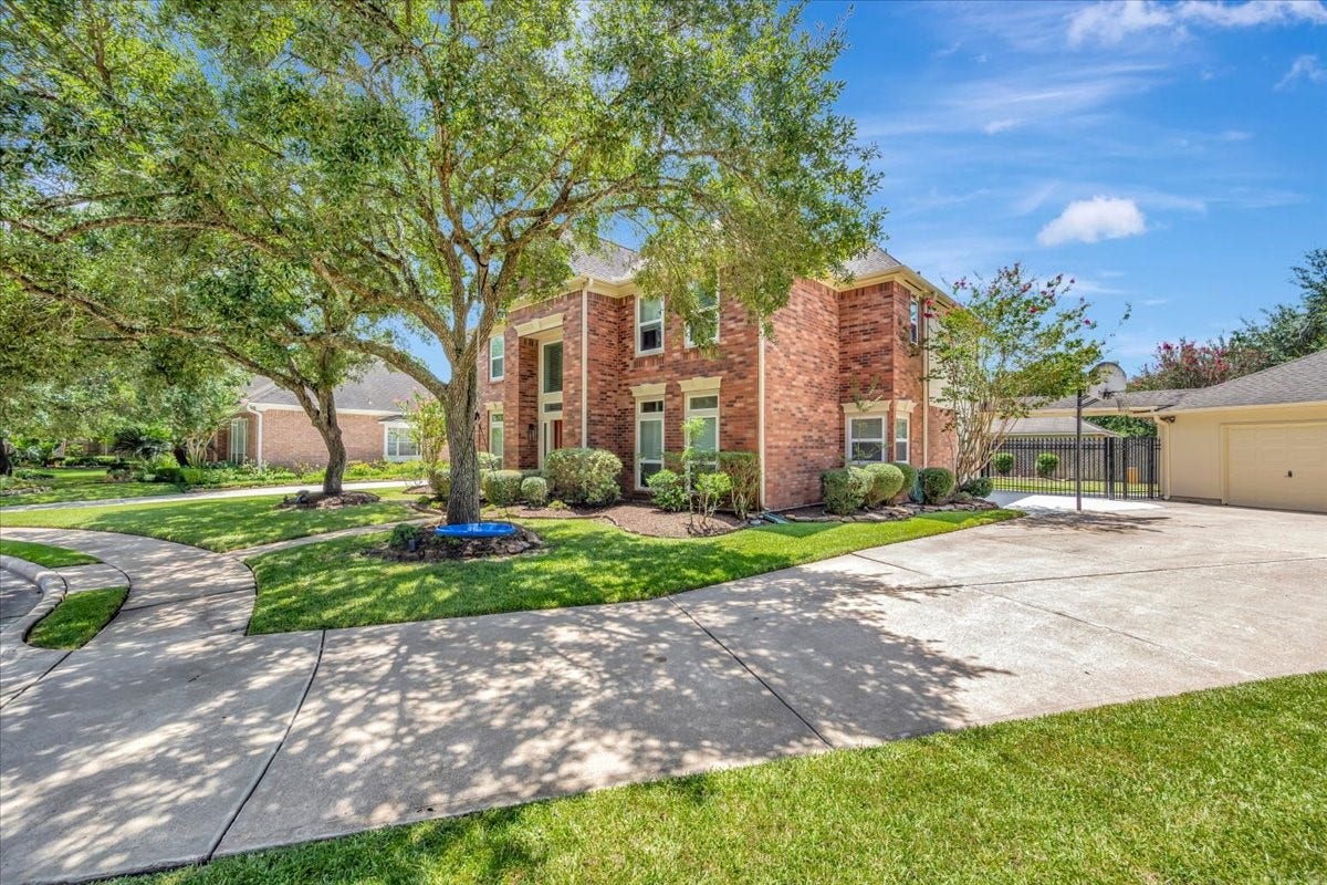 Oversized driveway leads to the detached 3-car garage, providing plenty of parking plus excellent space for hobbies, projects or a workshop.