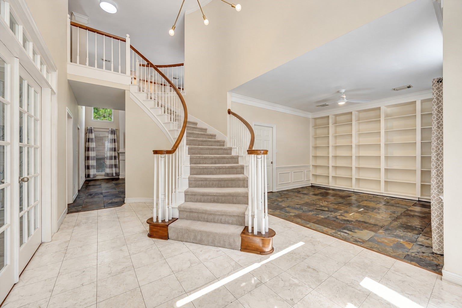 Working from home?  Large office with french doors just as you enter to the left.