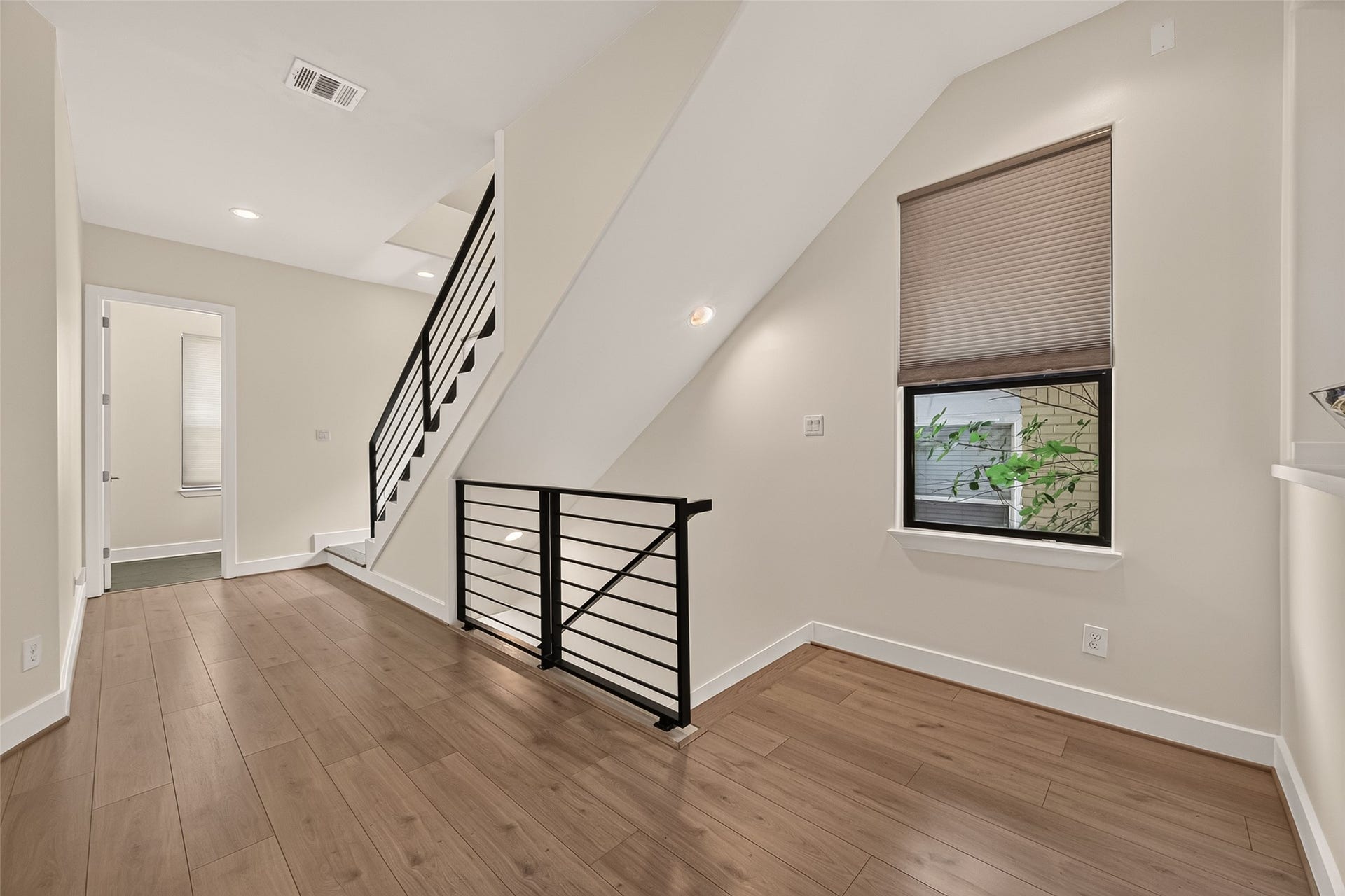 Bright wide hallway provides an a flex space.