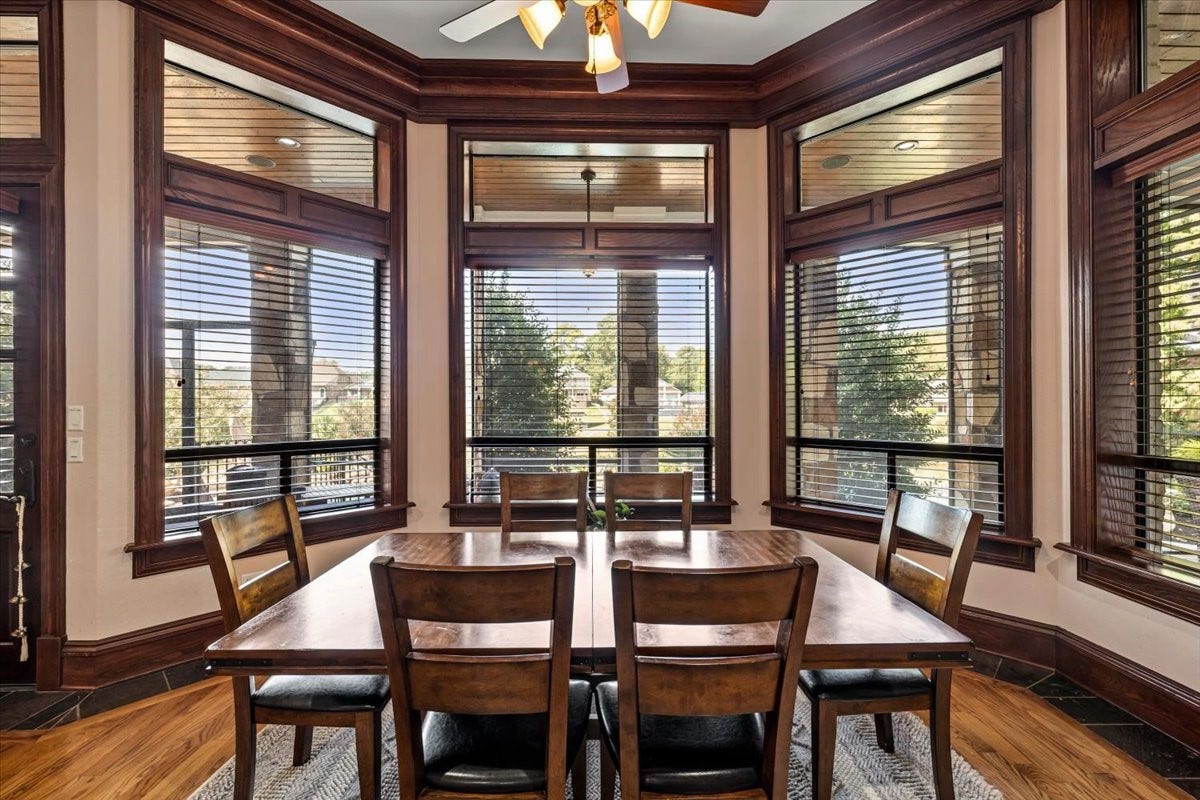 11860 Grand Harbor Boulevard, Montgomery, TX 77356 The breakfast room showcases the windows throughout the back of the home and the extensive wood trim details