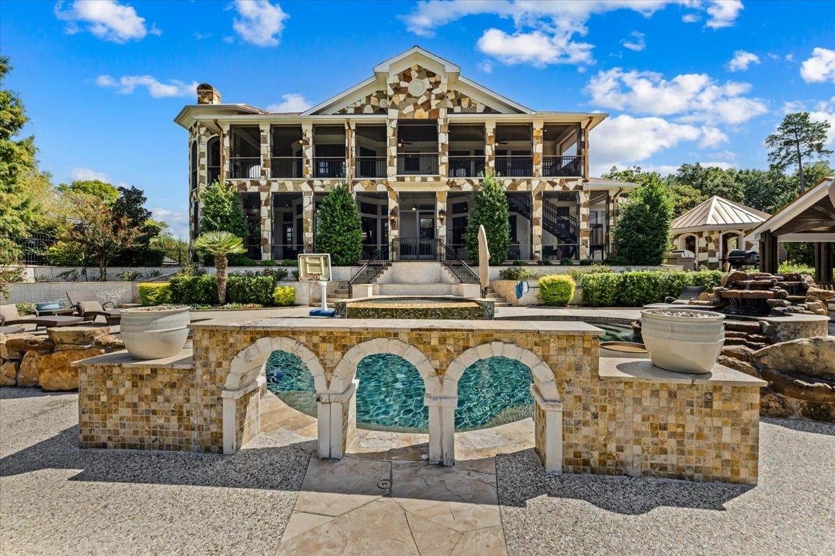 11860 Grand Harbor Boulevard, Montgomery, TX 77356 The pool area also features extensive stone work at every turn.
