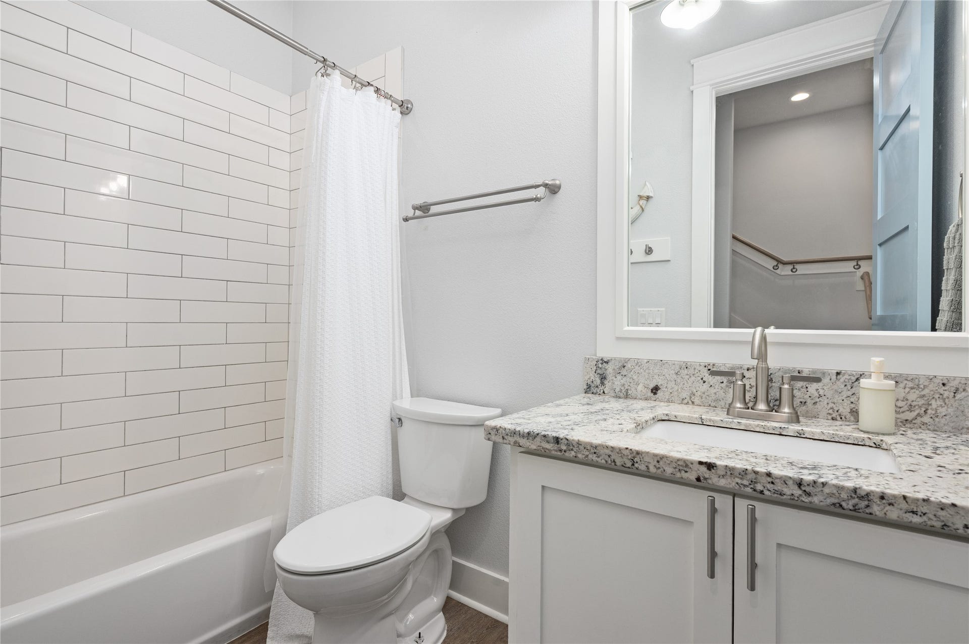 997 S Redfish Street, Crystal Beach, TX 77650 A bright full bath keeps mornings simple with a granite-topped vanity and subway-tile tub and shower surround.