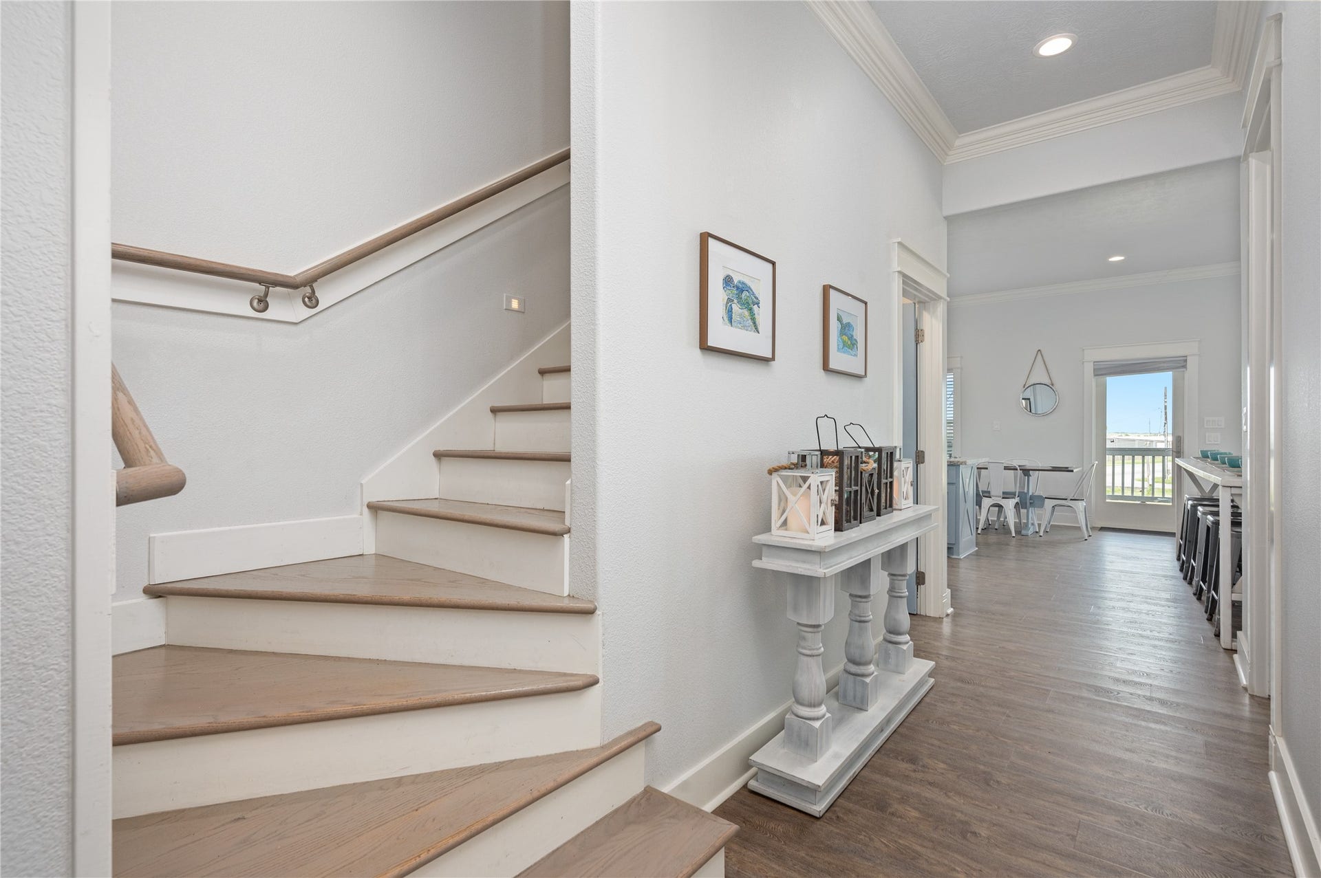 997 S Redfish Street, Crystal Beach, TX 77650 Moving through the home feels open and connected, with the staircase leading naturally into the main living spaces.