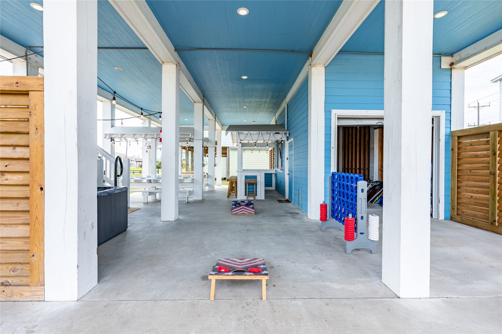 997 S Redfish Street, Crystal Beach, TX 77650 Game days happen right at home with a spacious covered entertaining area ready for cornhole, gatherings, and laid-back fun.