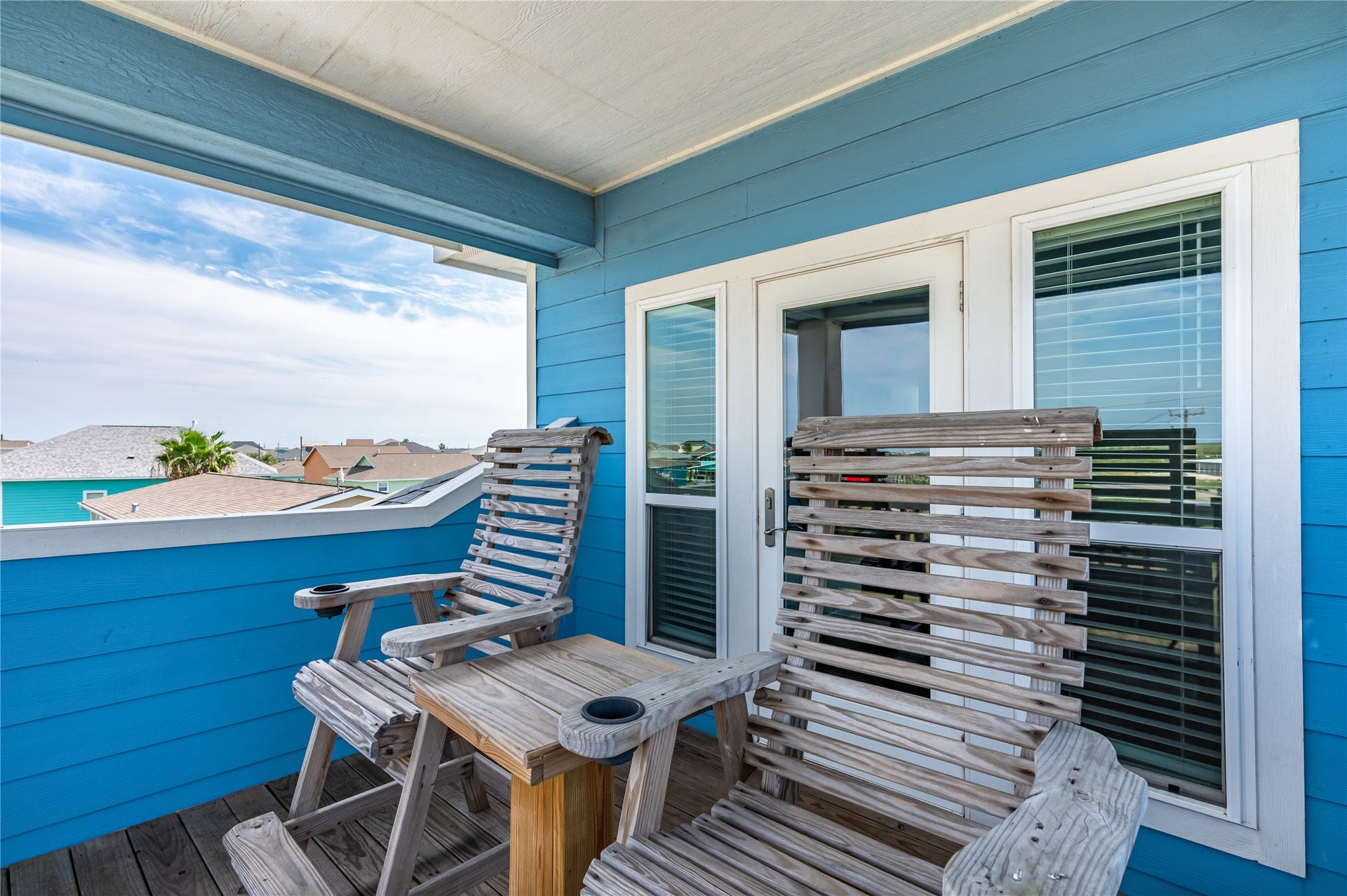 997 S Redfish Street, Crystal Beach, TX 77650 This private balcony gives you a comfortable outdoor spot just steps from the bedroom.