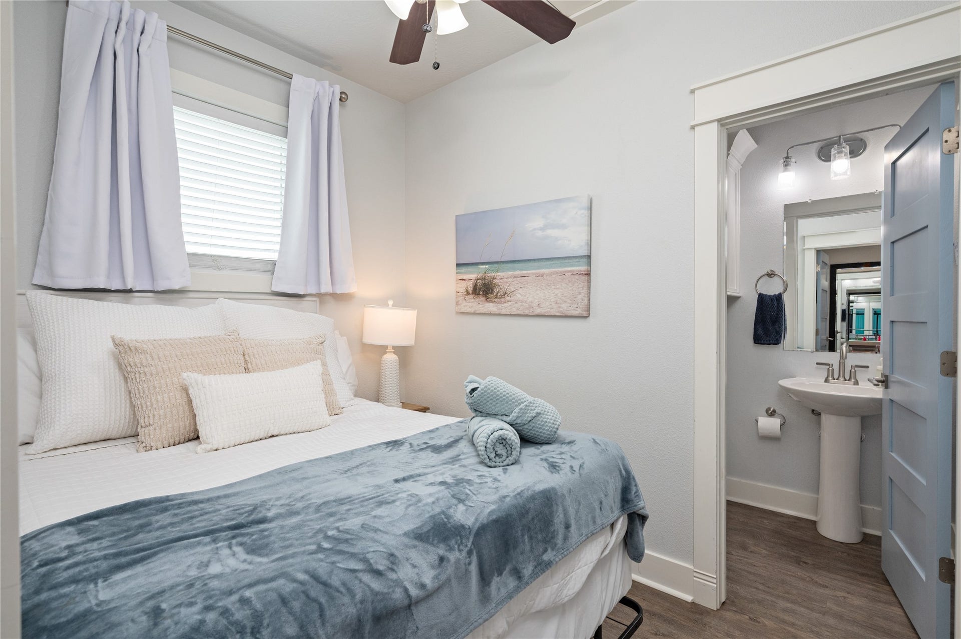 997 S Redfish Street, Crystal Beach, TX 77650 Settle into a cozy bedroom retreat with soft coastal styling and the convenience of an adjoining private bath.