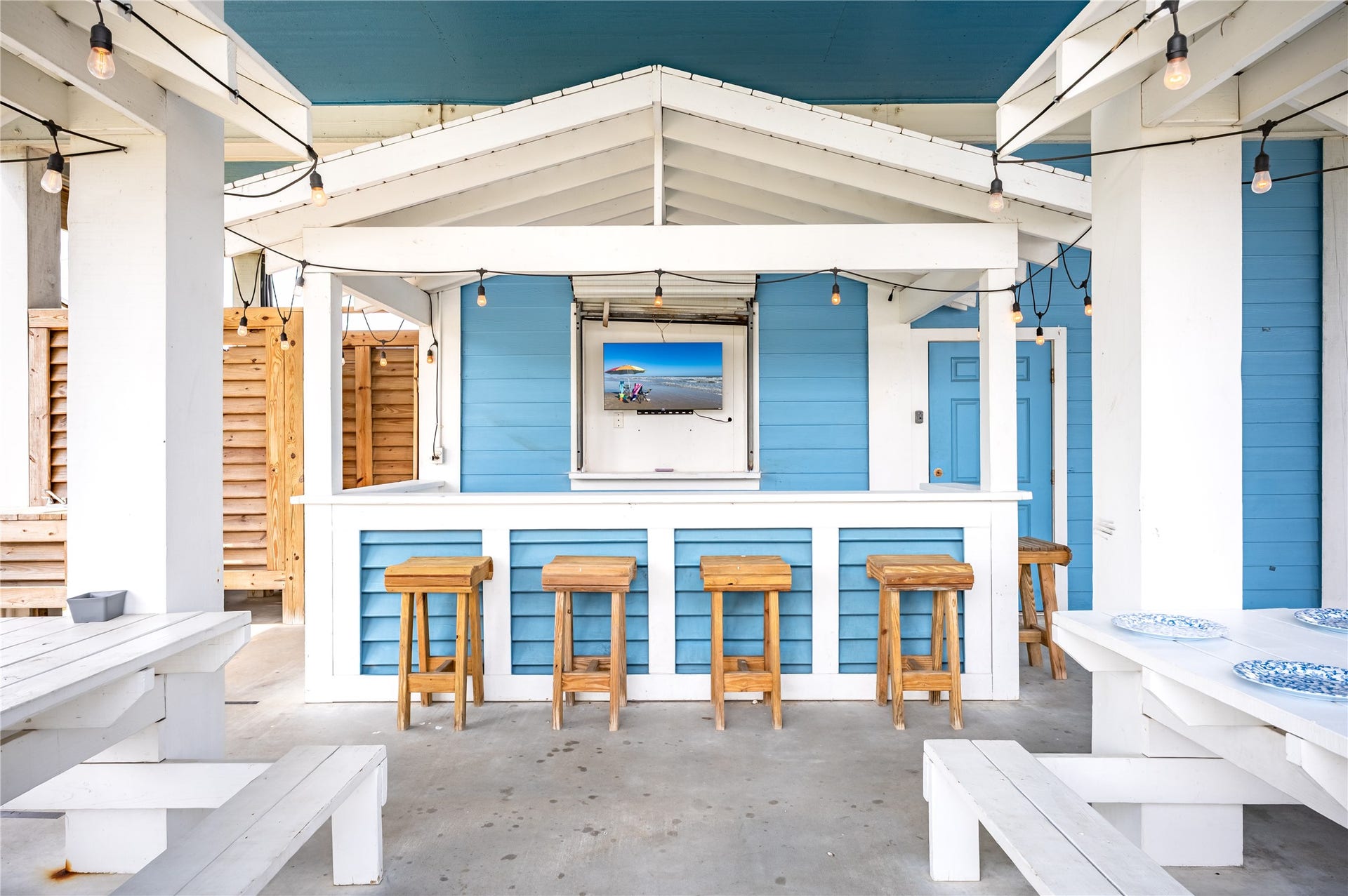 997 S Redfish Street, Crystal Beach, TX 77650 Weekends at home mean gathering around your covered outdoor bar, catching the game, and enjoying meals together under the string lights.