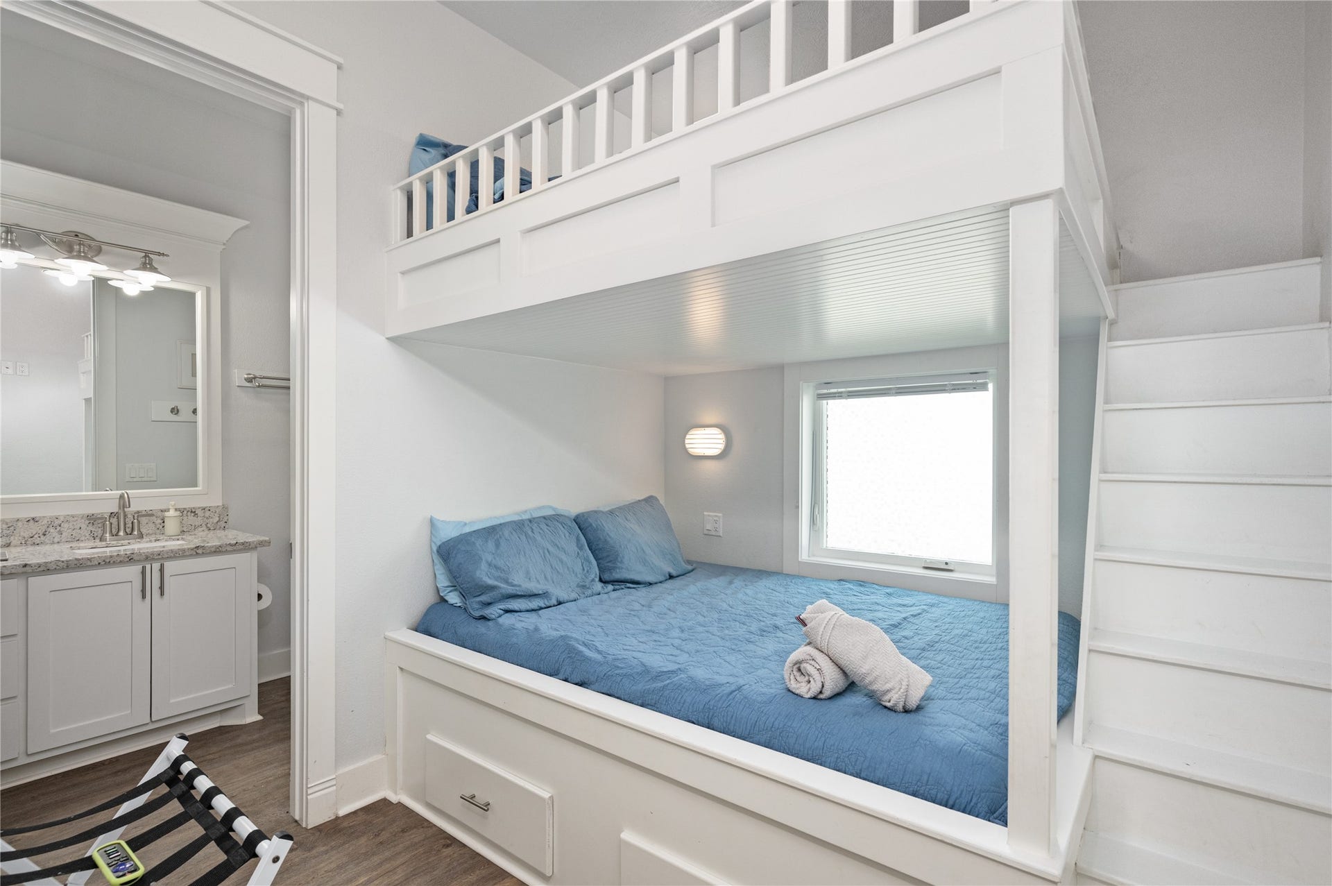 997 S Redfish Street, Crystal Beach, TX 77650 Extra sleeping space is cleverly built right in, with a cozy lower bed and loft above making excellent use of the room.