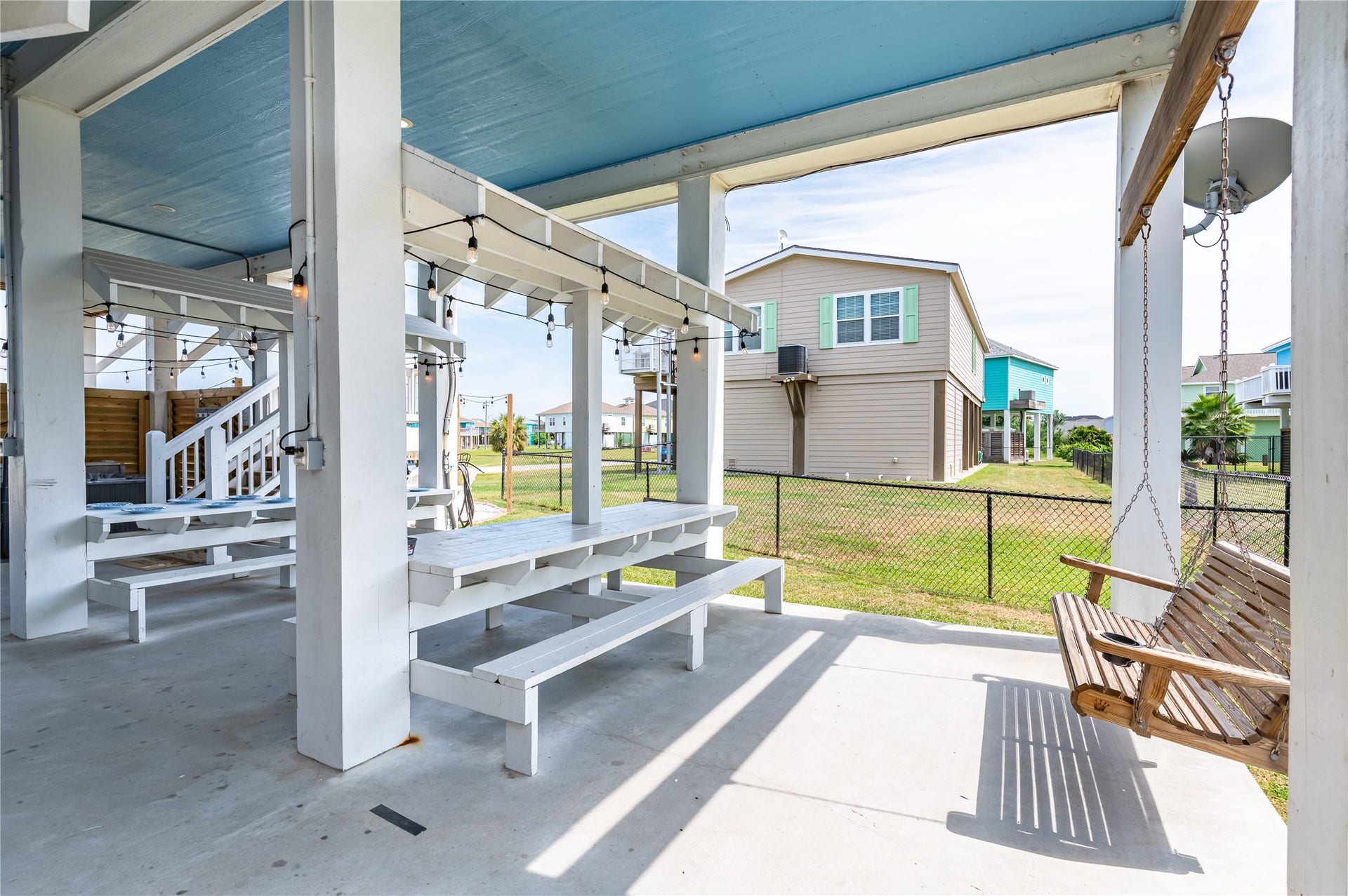 997 S Redfish Street, Crystal Beach, TX 77650 Lazy afternoons feel right at home in your shaded outdoor retreat, complete with picnic-table seating, a porch swing, and plenty of room to gather.