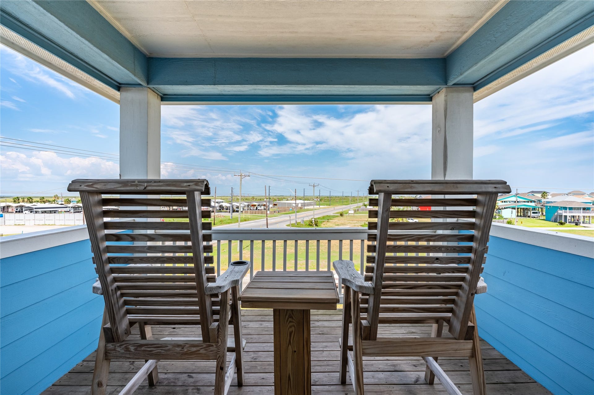 997 S Redfish Street, Crystal Beach, TX 77650 This tucked-away balcony becomes your favorite spot to slow down, settle into the rocking chairs, and enjoy the wide-open view.