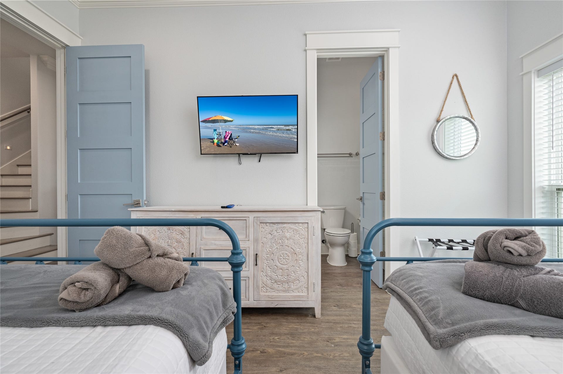 997 S Redfish Street, Crystal Beach, TX 77650 This comfortable guest room keeps everything close at hand with two beds, a wall-mounted TV, and convenient access to the adjoining bath.