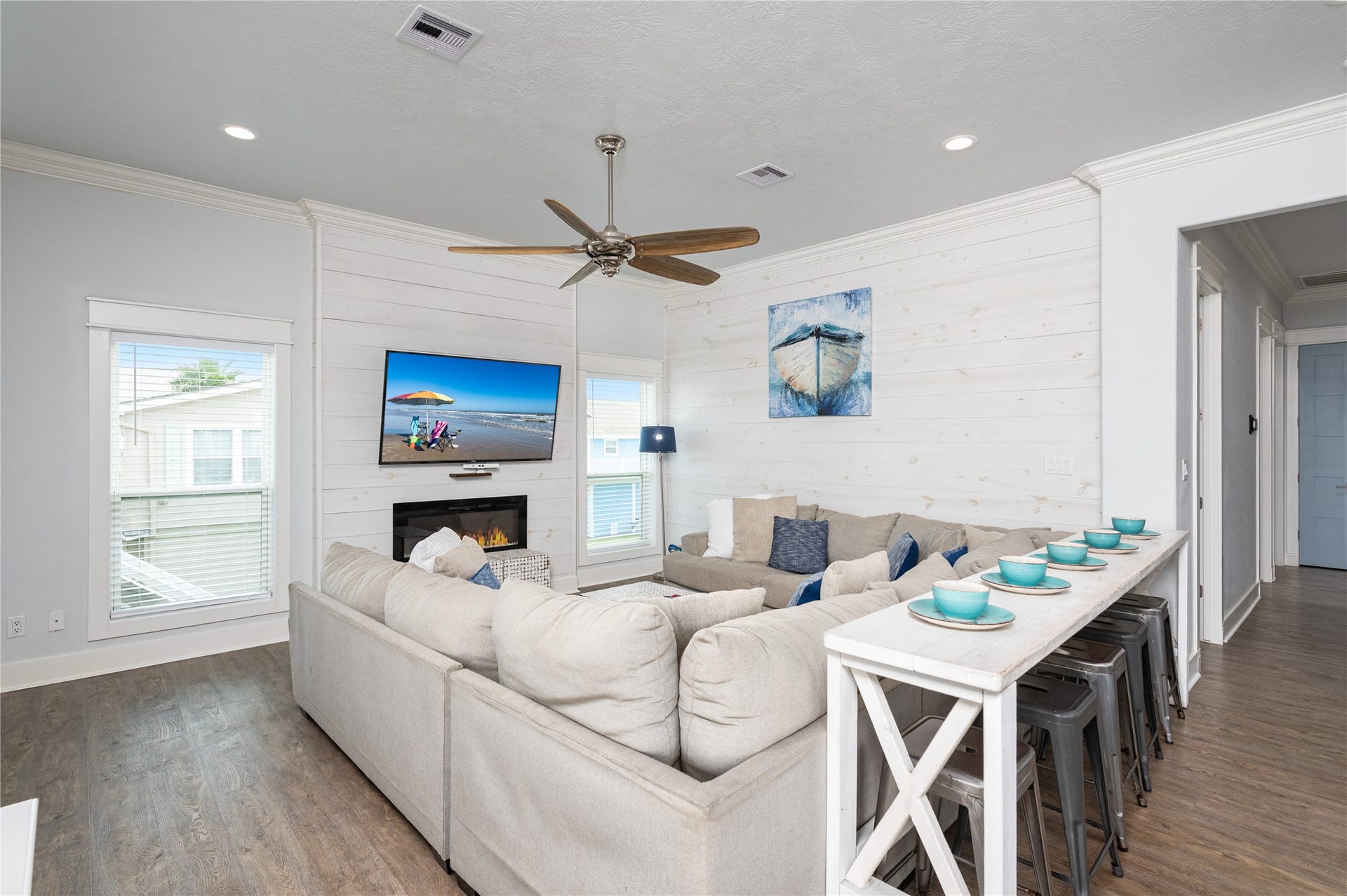 997 S Redfish Street, Crystal Beach, TX 77650 Settle into your inviting living room, where generous seating, coastal touches, and the fireplace create an easy place to unwind together.