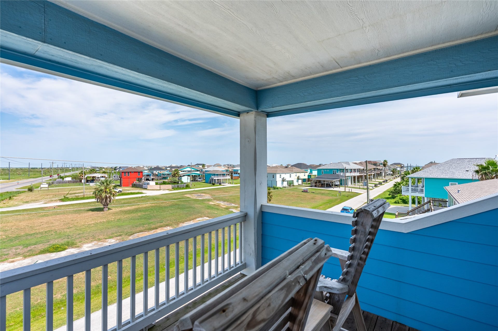 997 S Redfish Street, Crystal Beach, TX 77650 Step outside onto the covered balcony and settle in with an elevated view across the coastal neighborhood.