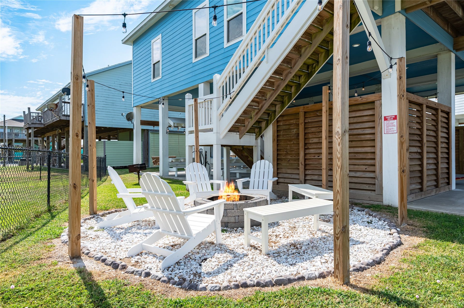 997 S Redfish Street, Crystal Beach, TX 77650 Evenings wind down around your private fire pit, where Adirondack chairs and string lights create the perfect spot for stories, drinks, and good company.