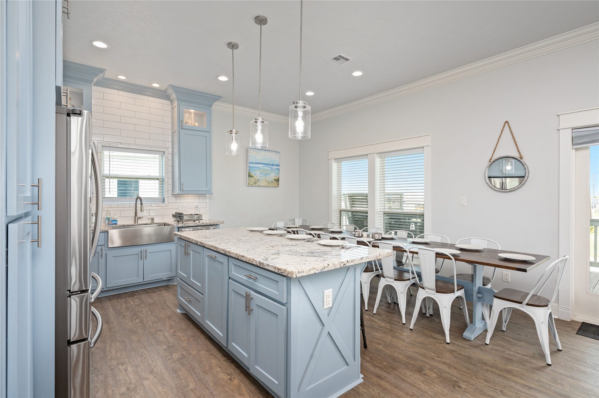 997 S Redfish Street, Crystal Beach, TX 77650 Big meals are easy at home, with your oversized island and long dining table providing plenty of seating for everyone to gather together.