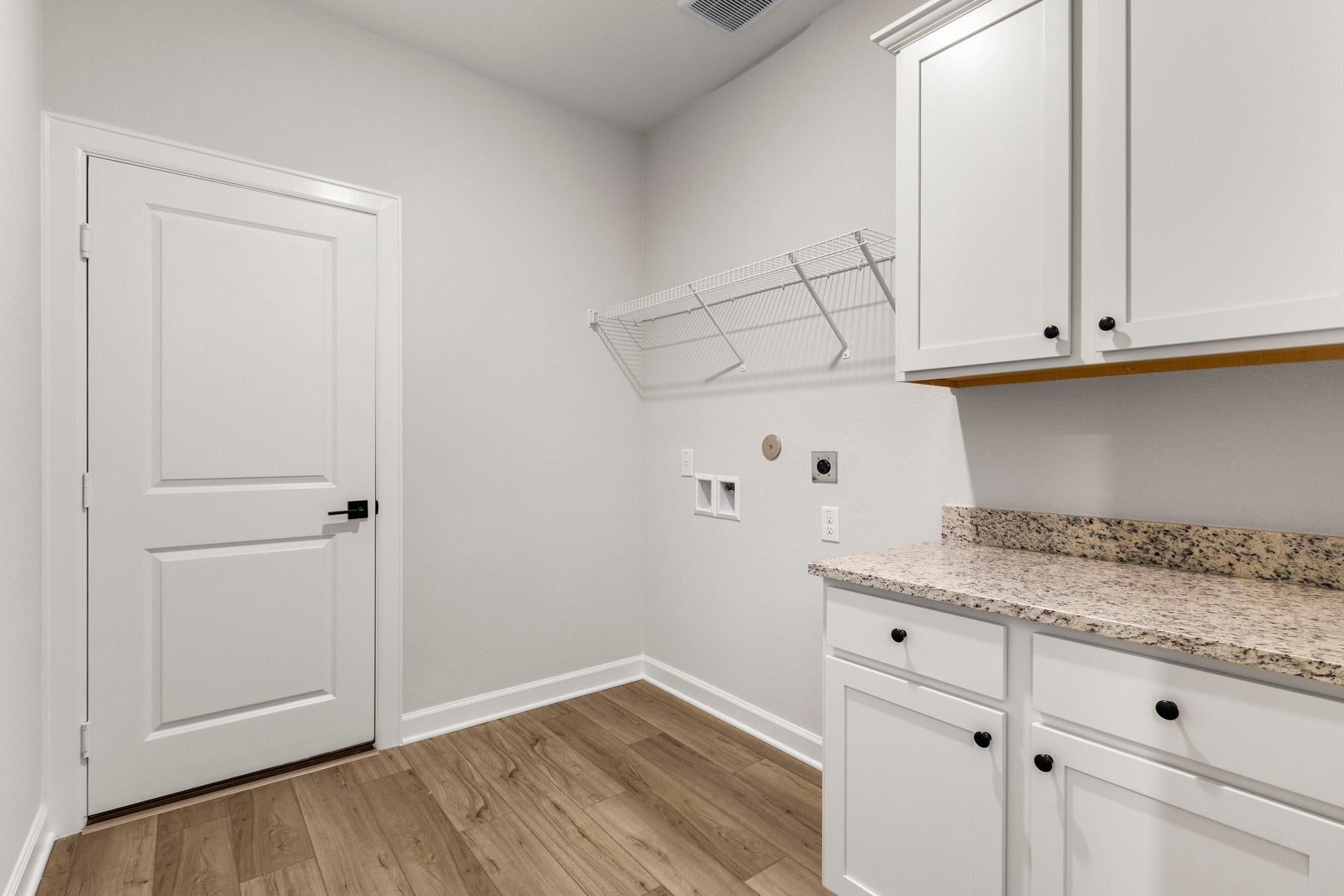 14001 Starboard Reach Drive, Texas City, TX 77510 The utility room features storage cabinets and folding station.