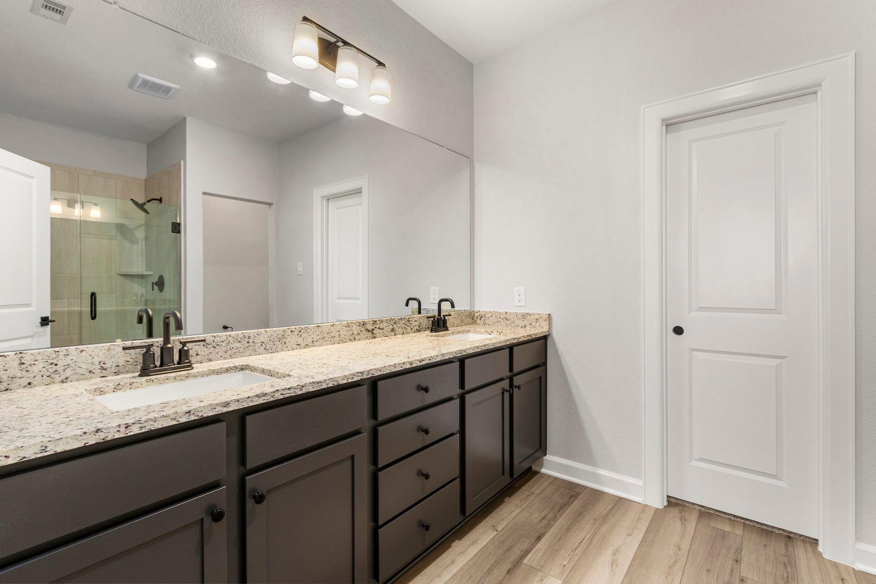 14001 Starboard Reach Drive, Texas City, TX 77510 The master bathroom features large double sink vanity with lots of cabinet storage.