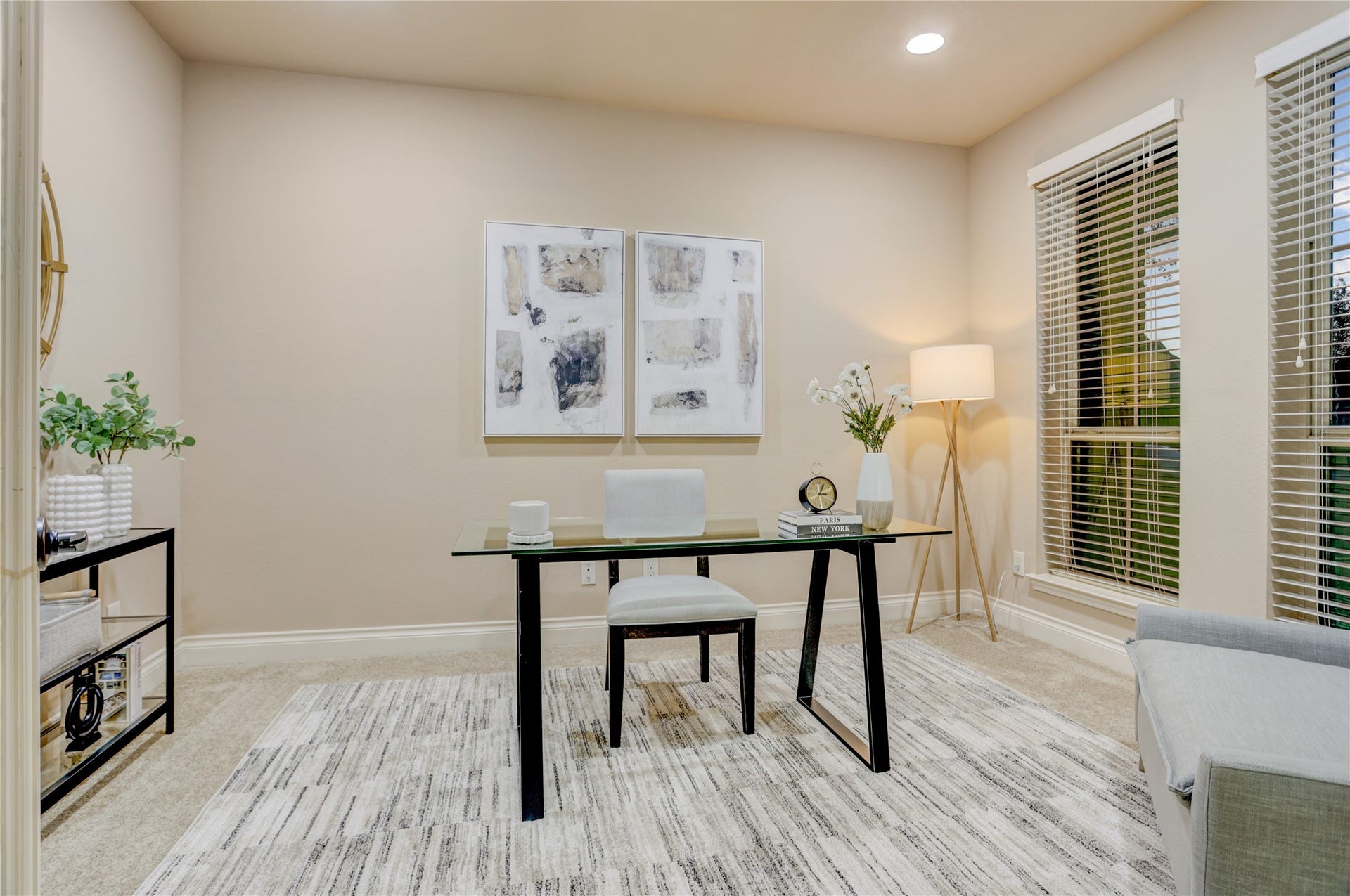13308 Paxton Hill Court, Pearland, TX 77584 Dedicated home office with elegant French doors, plush carpeting, and large windows that fill the space with natural light. This private workspace offers the perfect setting for working from home, studying, or creating a quiet reading room.