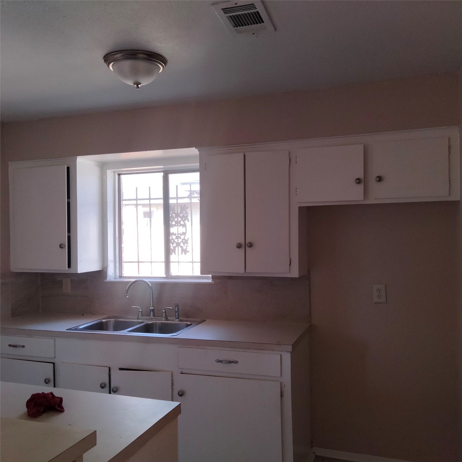 10926 Buffum Street, Houston, TX 77051 kitchen/ has a black refrig inside home