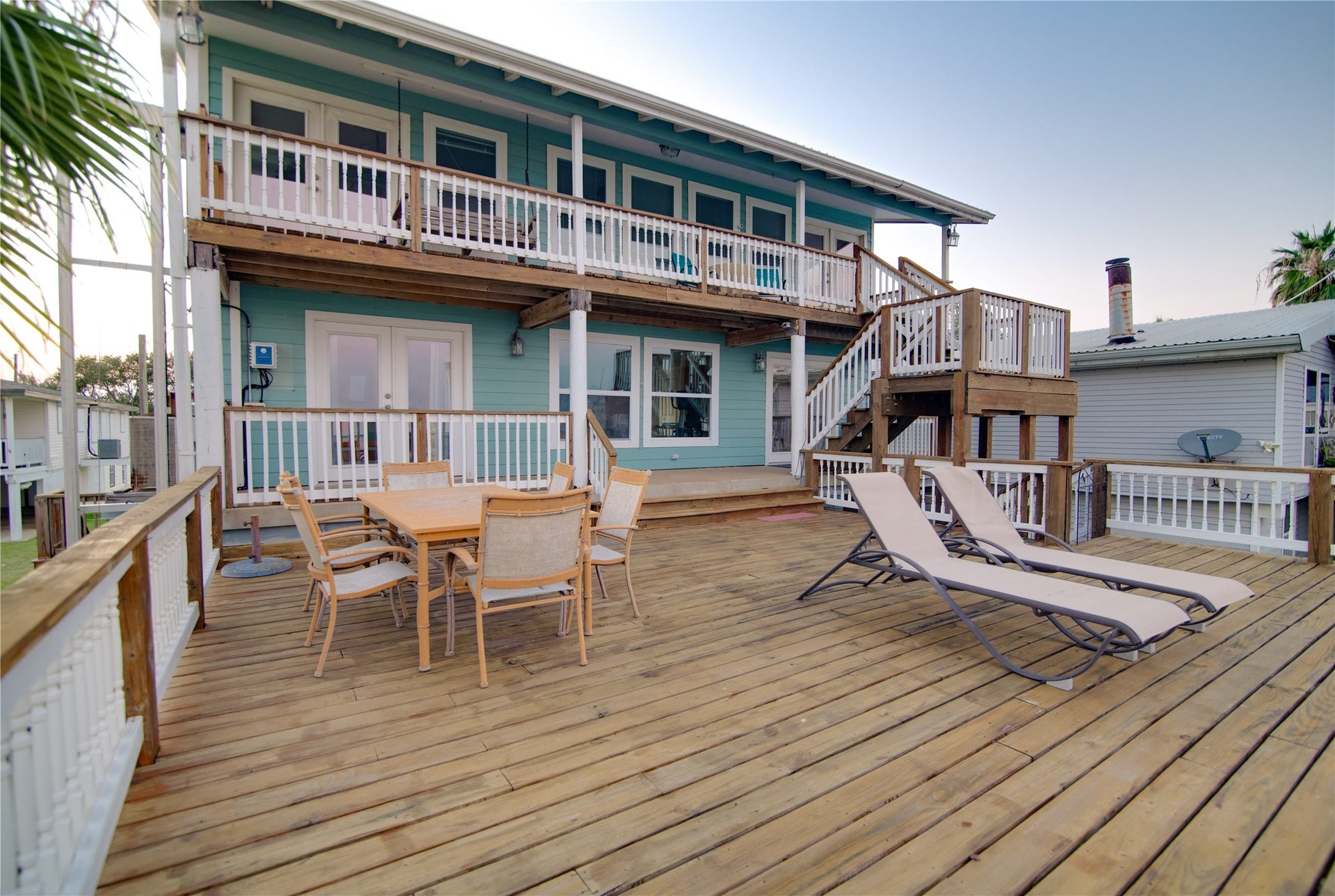 1309 8th Street, San Leon, TX 77539 This expansive deck stretches out toward the water, offering uninterrupted views of the shimmering bay. Spacious enough for lounging, dining, and entertaining, it provides the perfect spot to soak in sunsets or enjoy the gentle coastal breeze. With room for both relaxation and social gatherings, the deck seamlessly extends the living space outdoors, making waterfront living truly effortless and enjoyable.