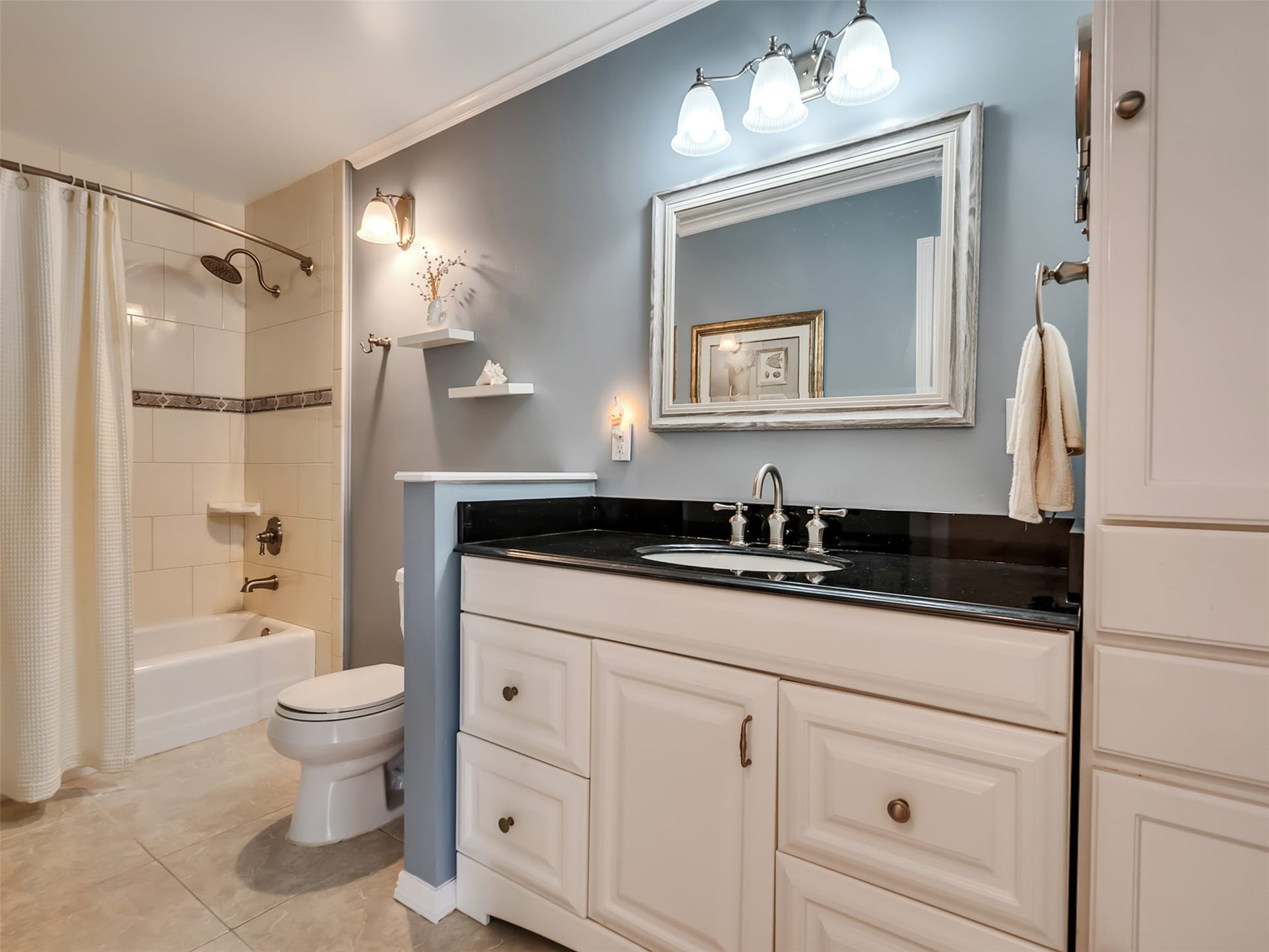 1309 8th Street, San Leon, TX 77539 This bathroom is sleek and perfect for getting ready.
