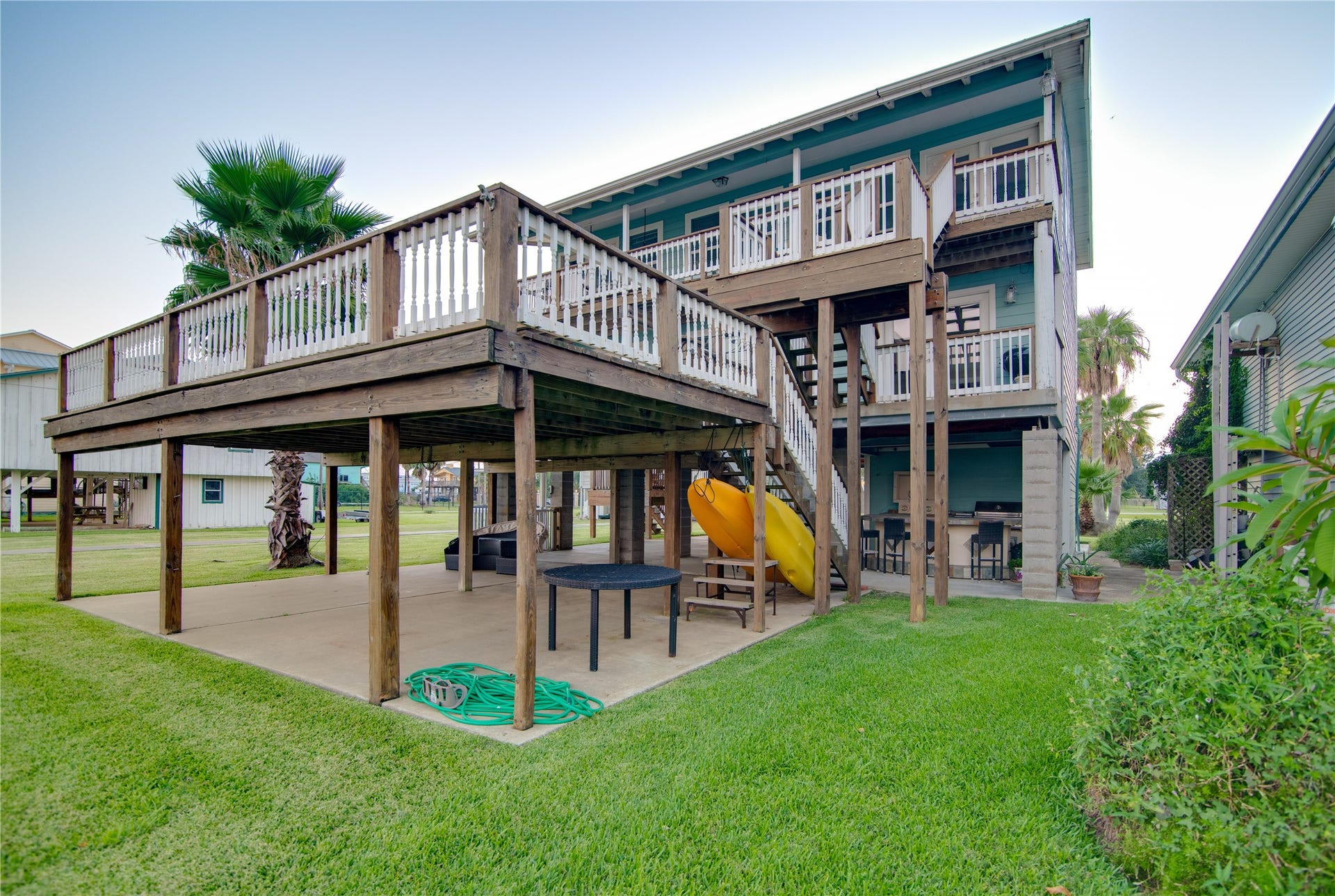 1309 8th Street, San Leon, TX 77539 Beneath, the covered area provides a spacious, sheltered zone perfect for outdoor entertaining, parking, or simply enjoying the breeze.