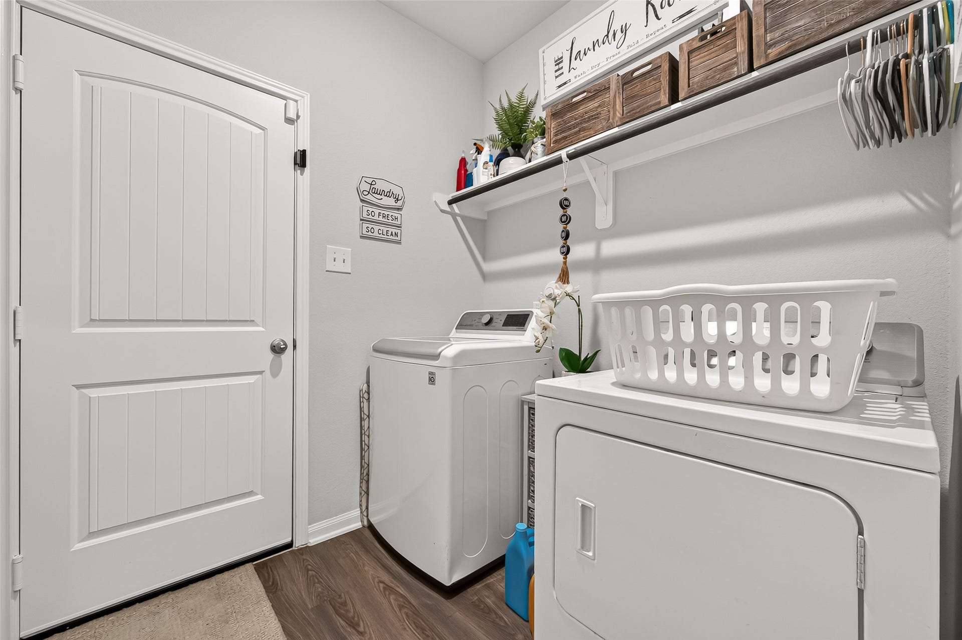 8422 Black Pearl Court, Texas City, TX 77591 Efficient and stylish laundry room featuring modern appliances, ample shelving, and a bright, organized space for easy chores.