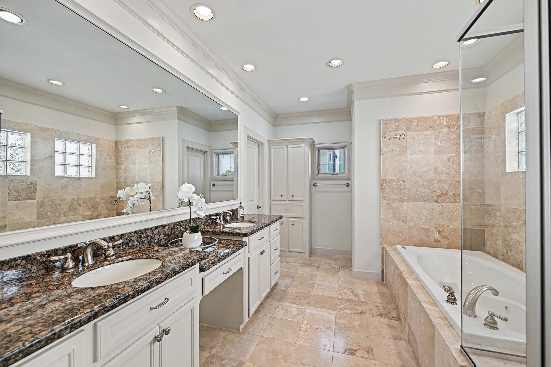 2410 Mimosa Drive, Houston, TX 77019 Primary bath boasts dual vanity, soaking tub and walk in shower
