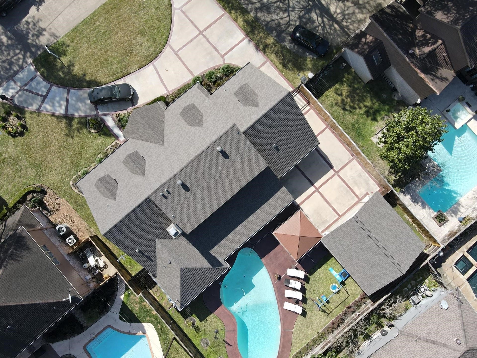 6235 Rolling Water Drive, Houston, TX 77069 This aerial photo showcases a spacious home with a large driveway, a well-maintained yard, and a private backyard featuring a swimming pool and patio area.