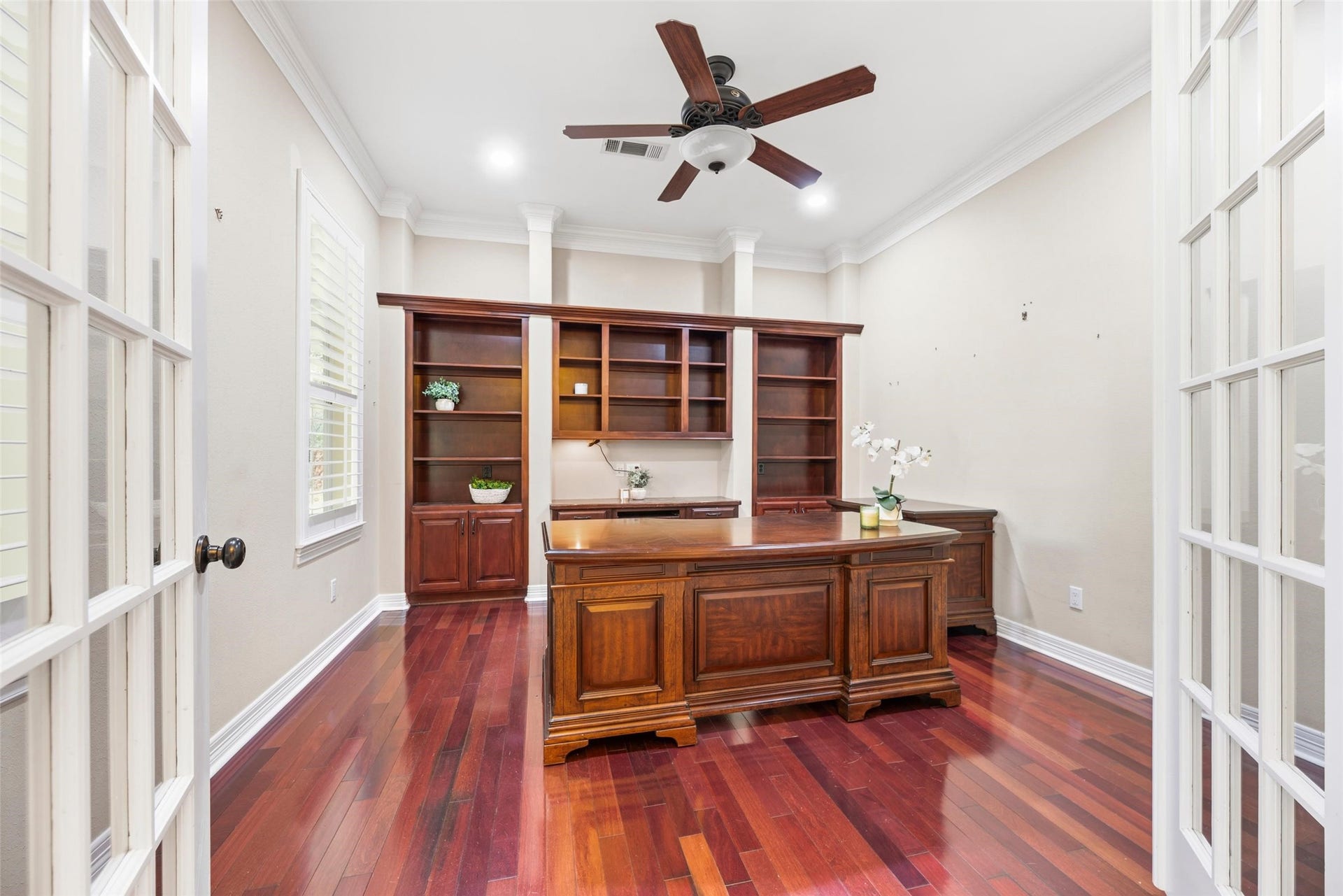 Downstairs study with built-ins and French doors.