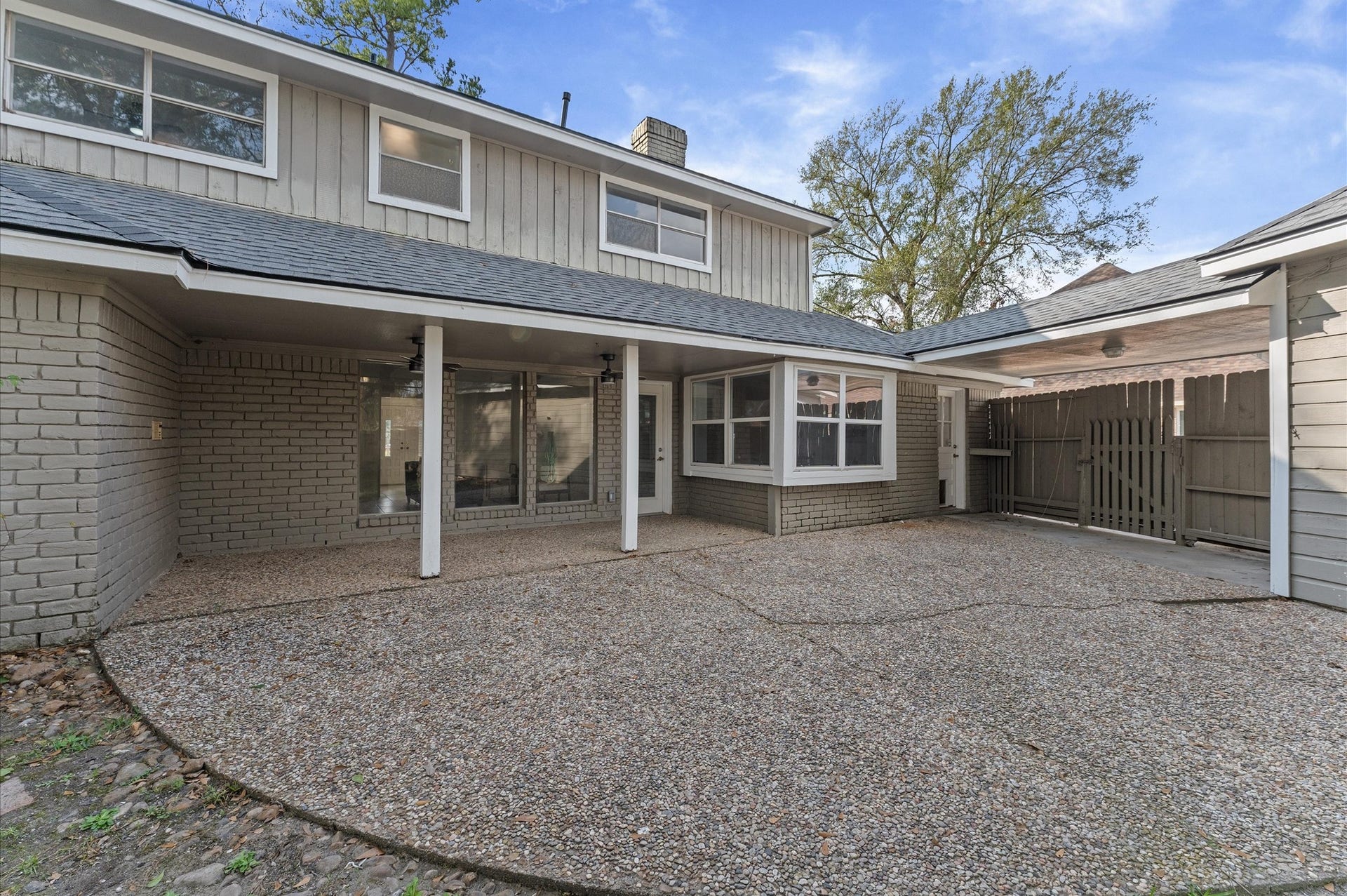 Check out this amazing backyard patio! Relax in the shade of the covered area, or set up for entertaining and play on the large open area.