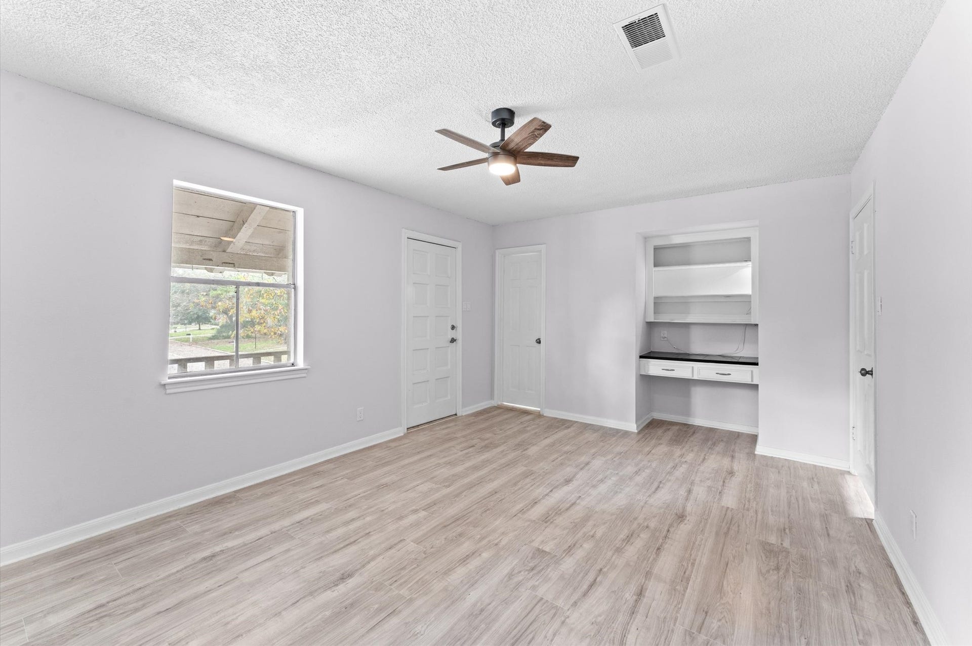 Bedroom 3 has a built-in desk area.
