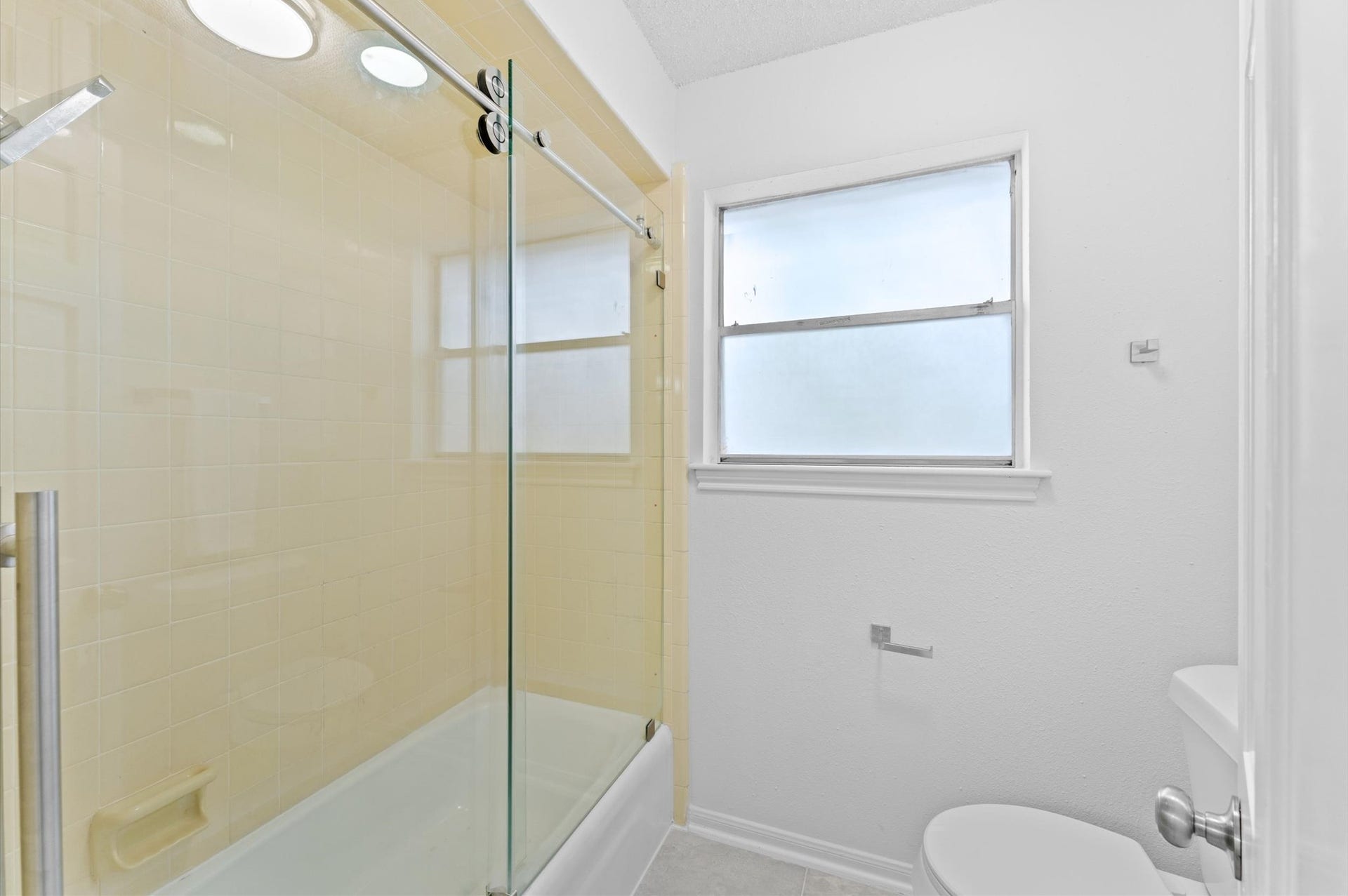 Every bit as stylish as the bathroom with a shower-only design, this tub and shower combination is ready for those who prefer bubble baths.