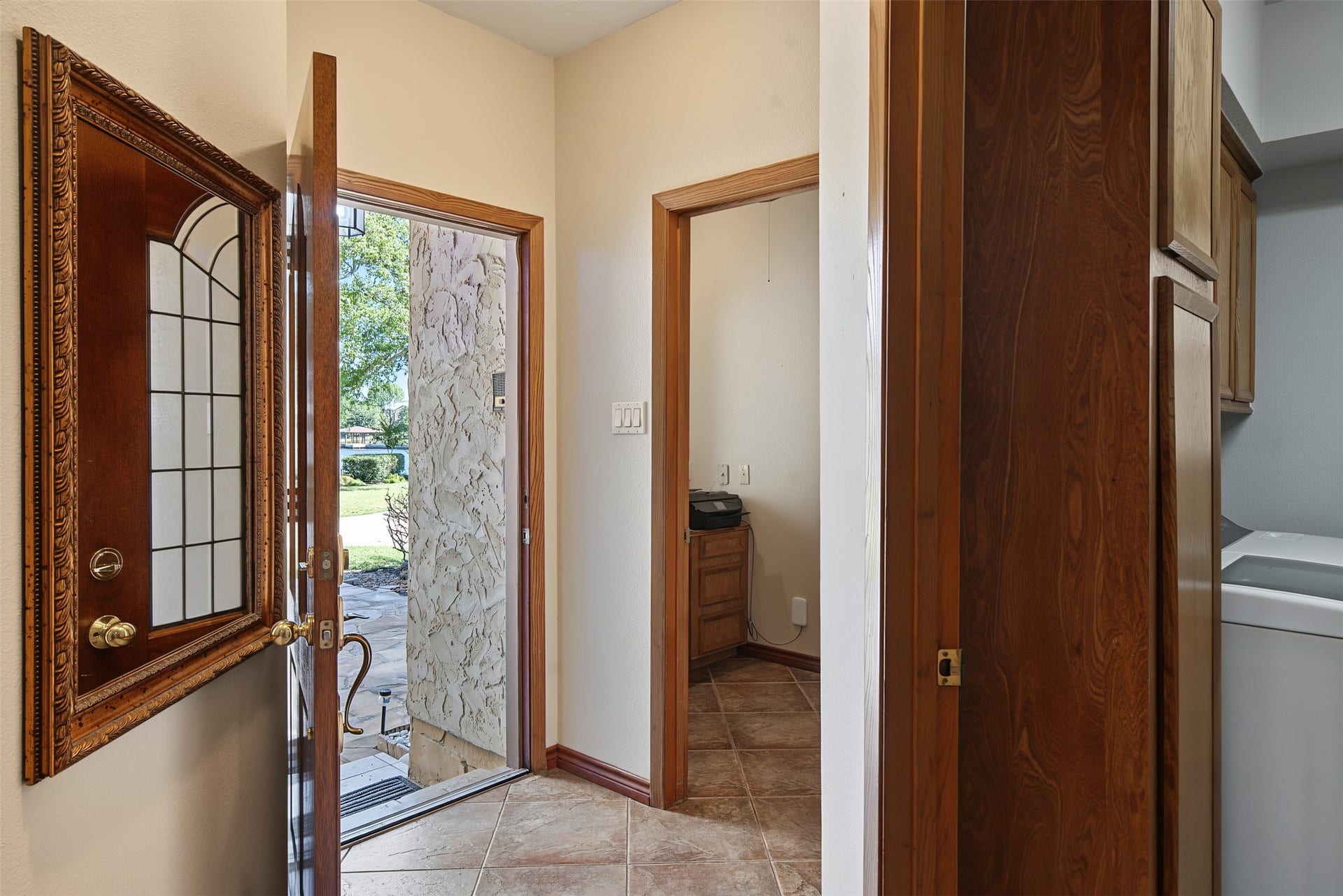 Look closely and you will see the water view across the street.  Office is at the front with access to the laundry and half bath.