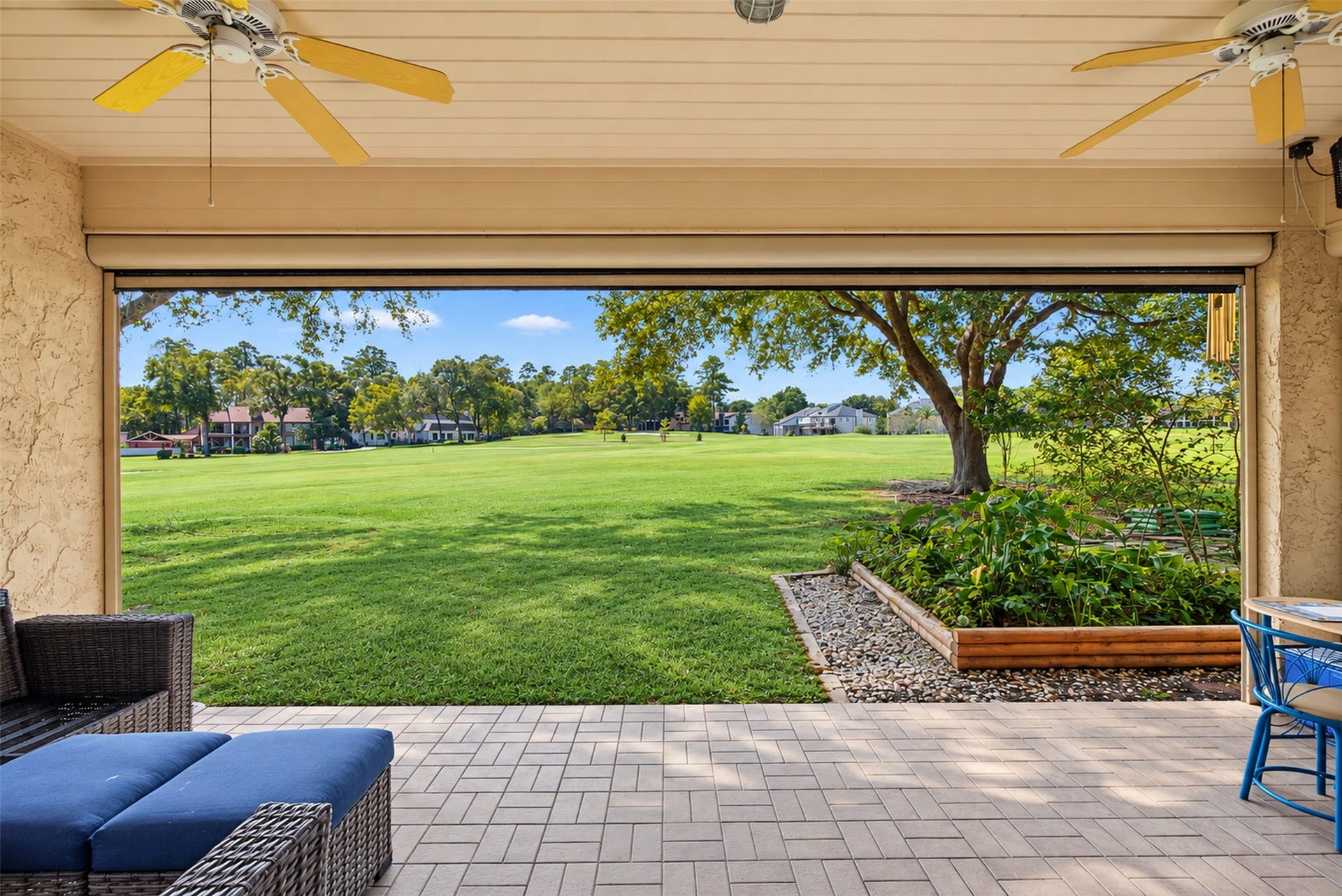 Covered back patio with roll down screen.