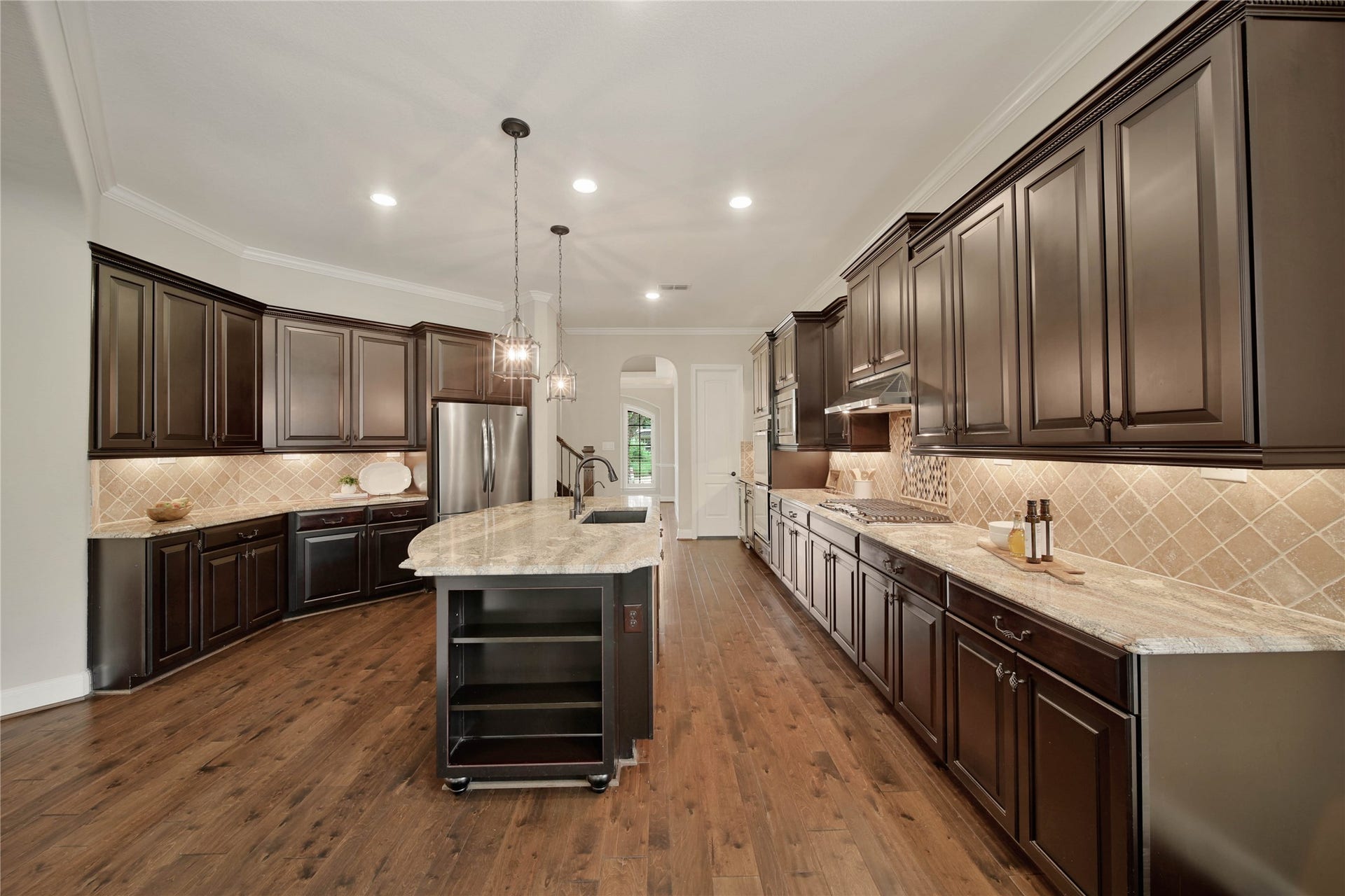 A gourmet kitchen every chef will love, featuring exceptional finishes, abundant workspace, and premium amenities. Enjoy the convenience of pull-out cabinet shelves, offering easy access and efficient use of every inch of storage space.