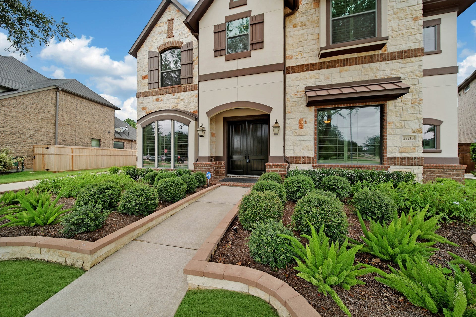 Elegant 8-foot double front doors welcome you inside and hint at the exceptional finishes found throughout the home.