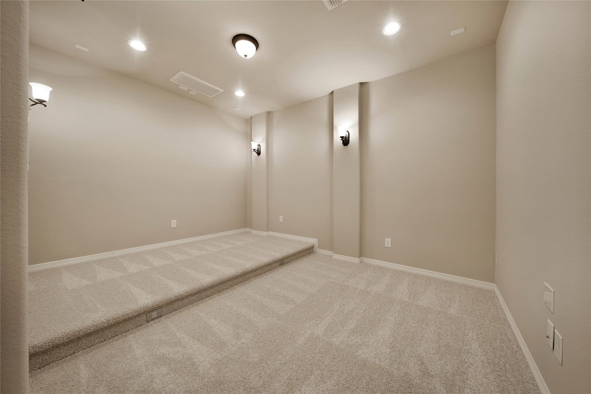 The media room is wired for surround sound and features tiered seating for an immersive theater experience, making movie nights, sporting events, and gatherings even more enjoyable.