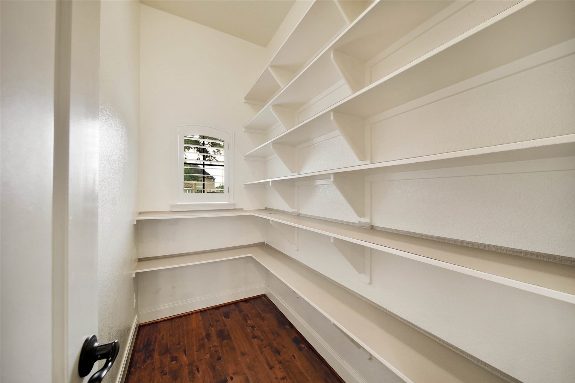A true standout feature, the oversized walk-in pantry provides exceptional storage and convenience for the home chef and busy household.