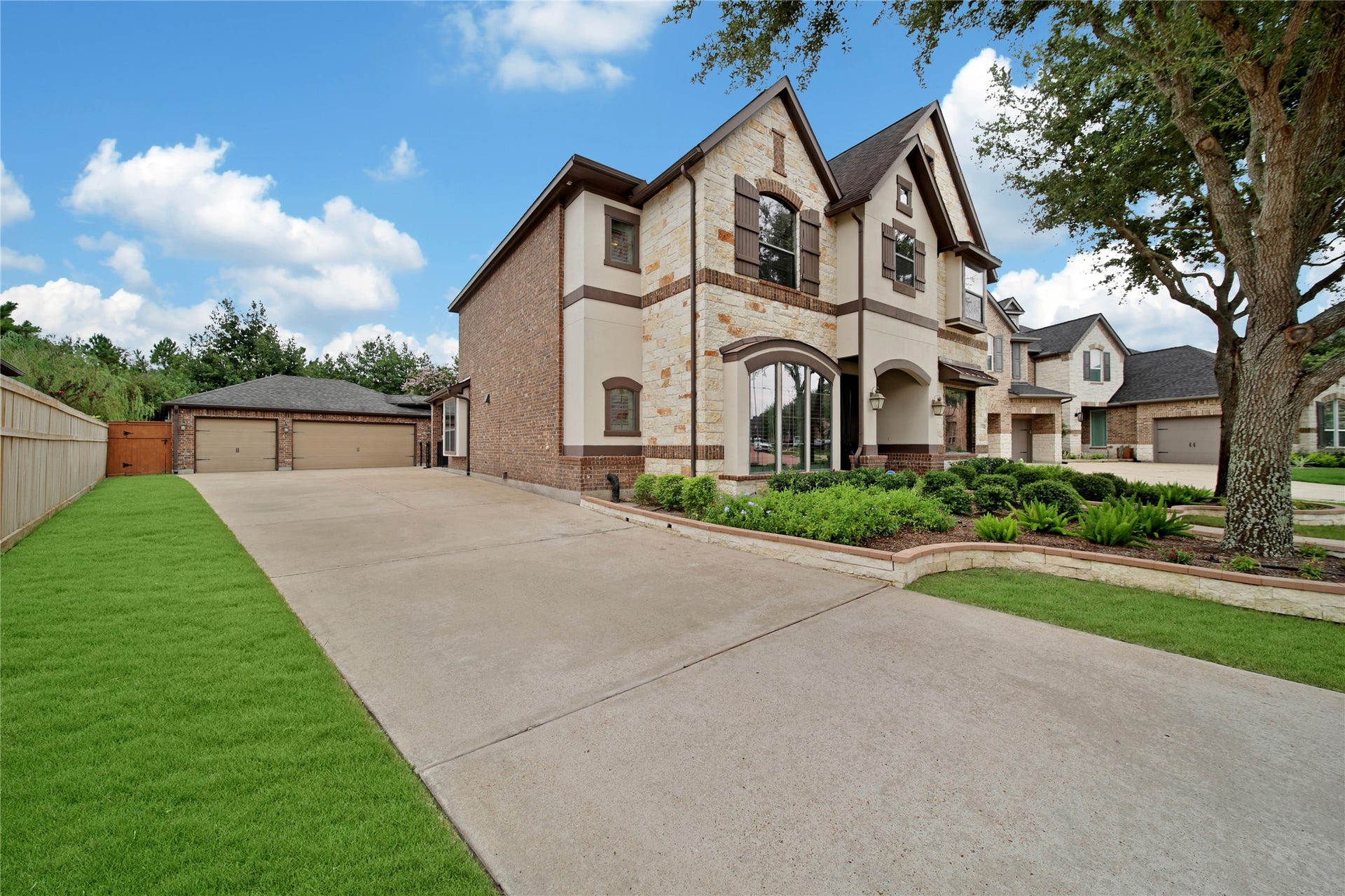 The true detached 3-car garage provides plenty of space for vehicles, storage, and all your weekend projects. A long driveway offers additional parking for family and guests.