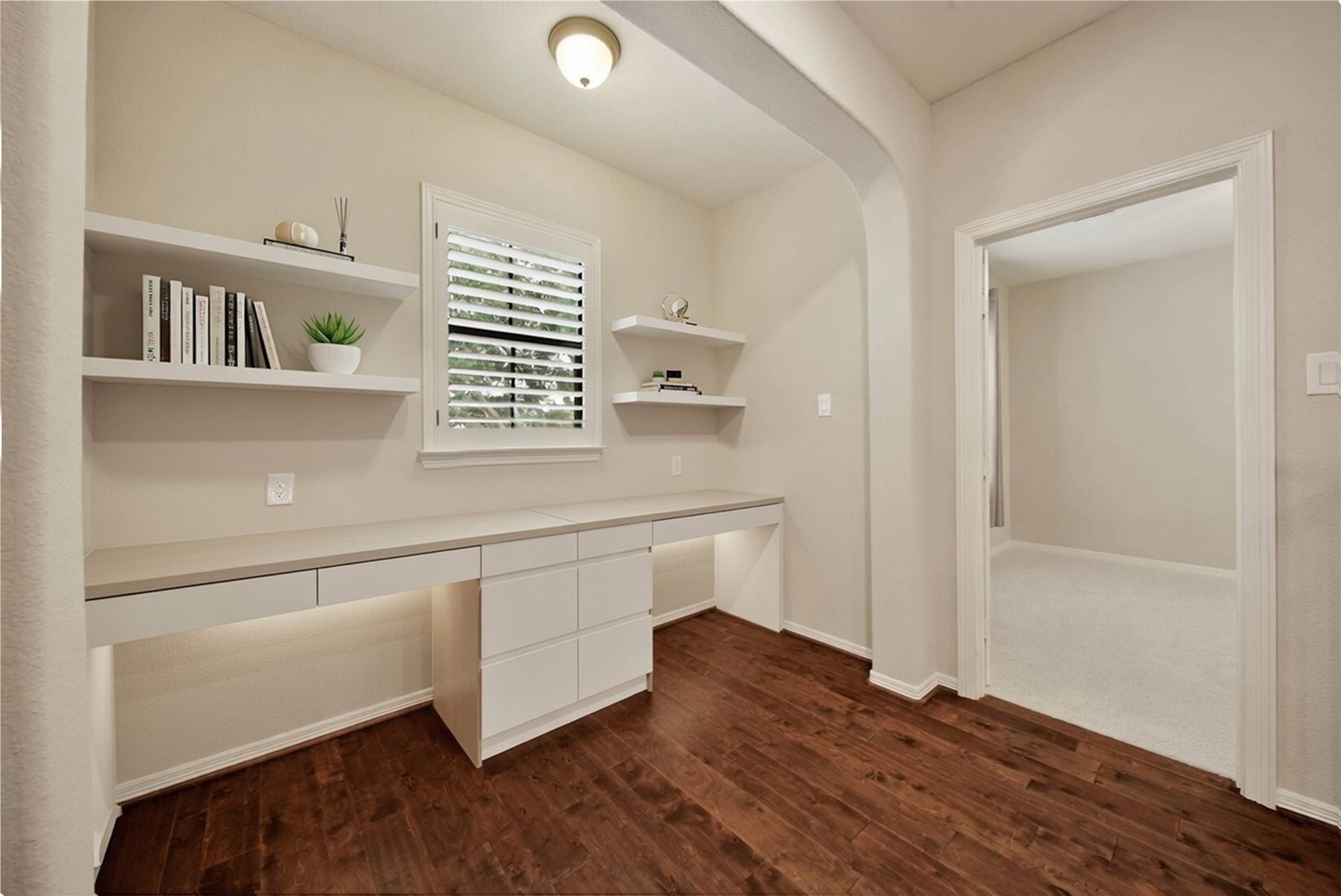 At the top of the stairs, this hallway niche offers endless possibilities and can easily be transformed into the perfect study area, hobby space, or craft nook. (virtually staged)